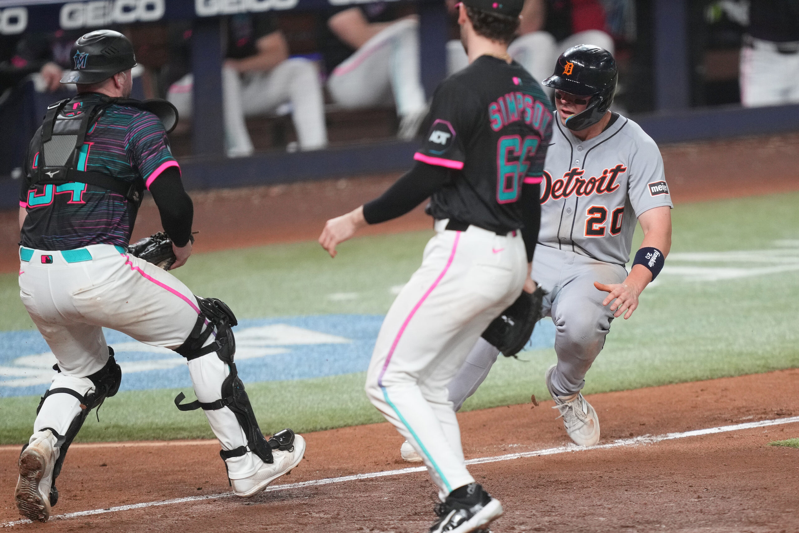 Sep 13, 2025; Miami, Florida, USA;  Miami Marlins catcher Liam Hicks (34) runs down Detroit Tigers first baseman Spencer Torkelson (20) at home plate in the 11th inning at loanDepot Park. Mandatory Credit: Jim Rassol-Imagn Images