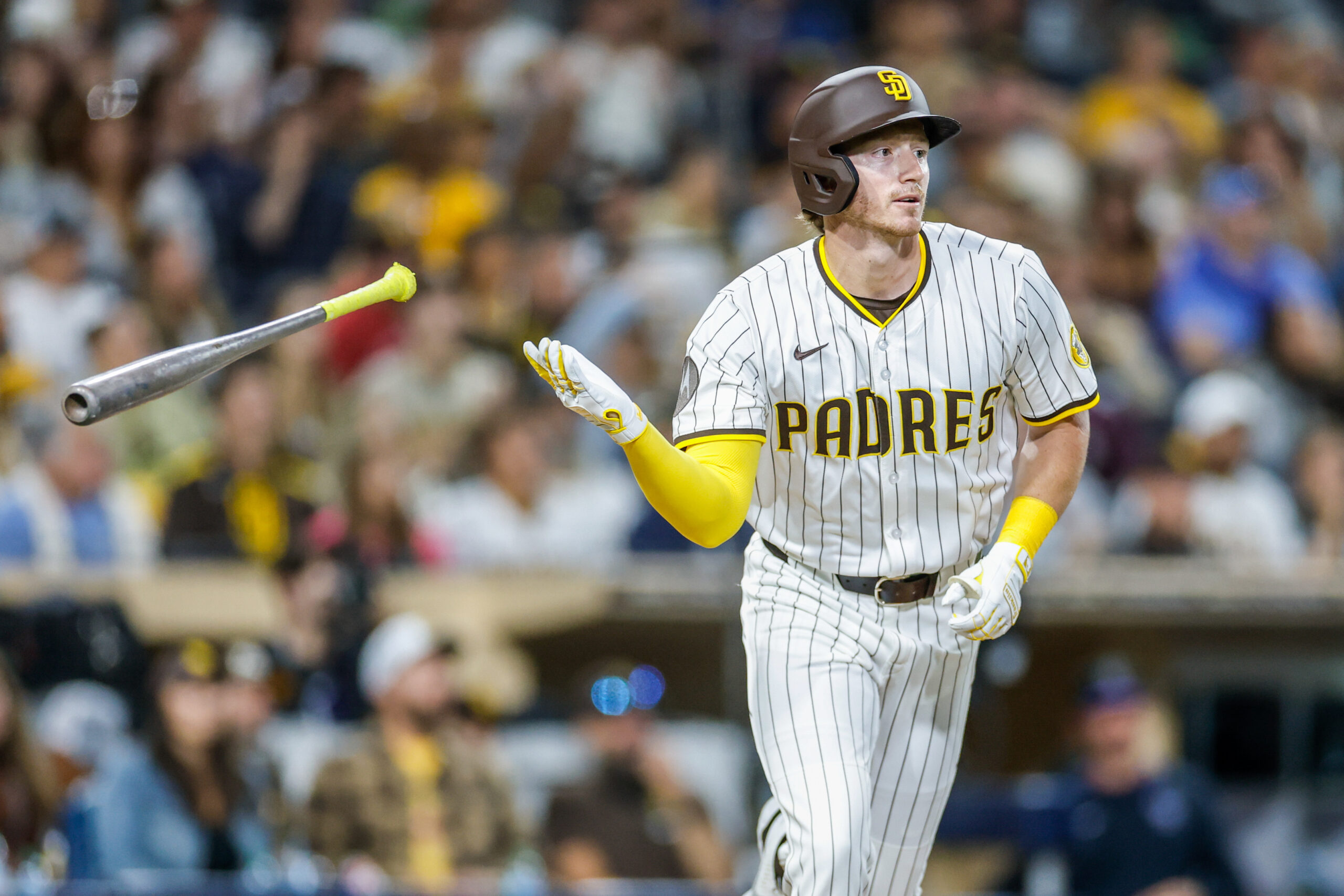 Sep 13, 2025; San Diego, California, USA; San Diego Padres pitch hitter Bryce Johnson (29) flips his bat after hitting a two-run home run during the eighth inning against the Colorado Rockies at Petco Park. Mandatory Credit: David Frerker-Imagn Images
