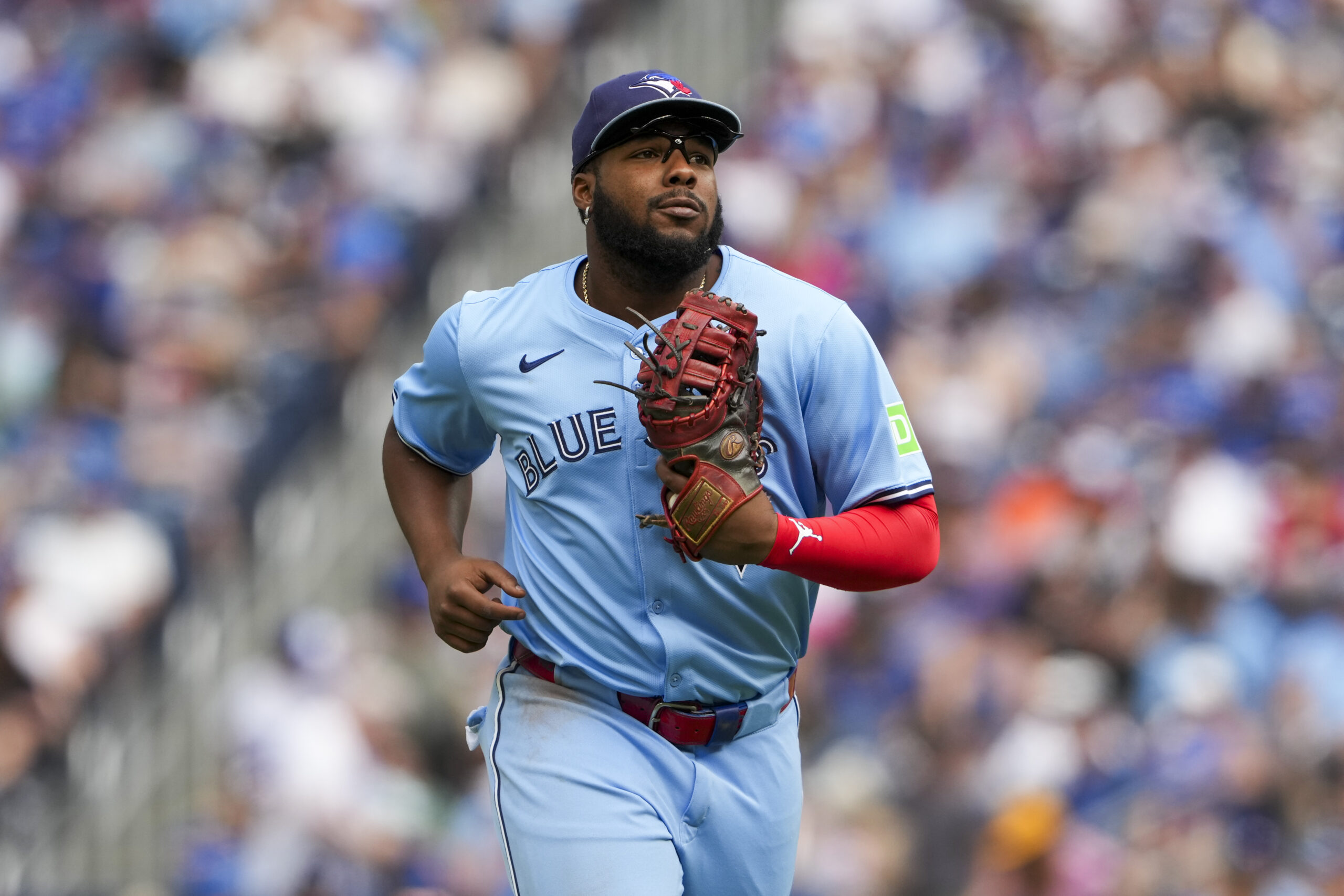 Sep 14, 2025; Toronto, Ontario, CAN; Toronto Blue Jays first base Vladimir Guerrero Jr. (27) runs back to the dugout after the second inning against the Baltimore Orioles at Rogers Centre. Mandatory Credit: Kevin Sousa-Imagn Images