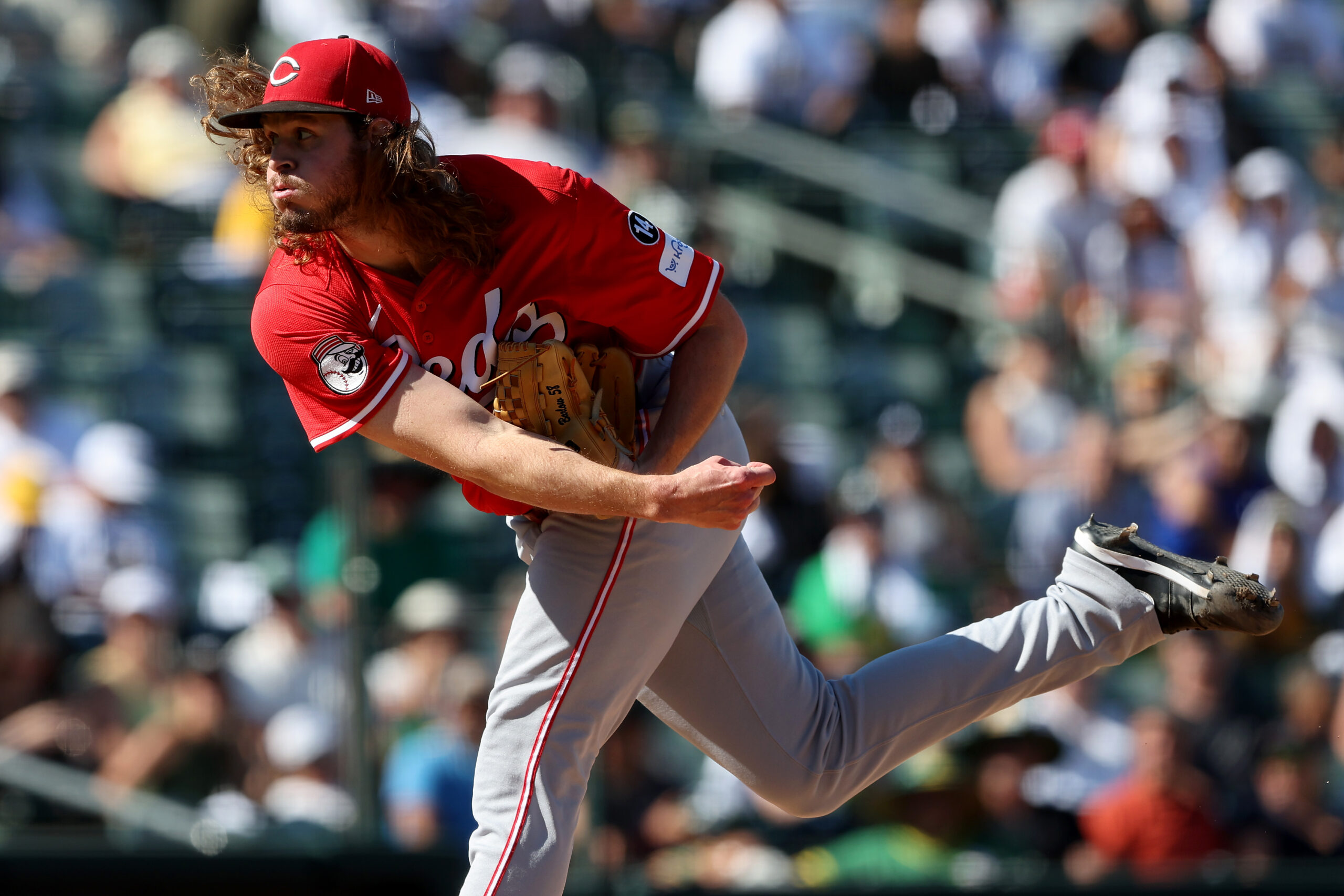 Sep 14, 2025; West Sacramento, California, USA; Cincinnati Reds pitcher Scott Barlow (58) throws a pitch against the Athletics during the eighth inning at Sutter Health Park. Mandatory Credit: Dennis Lee-Imagn Images