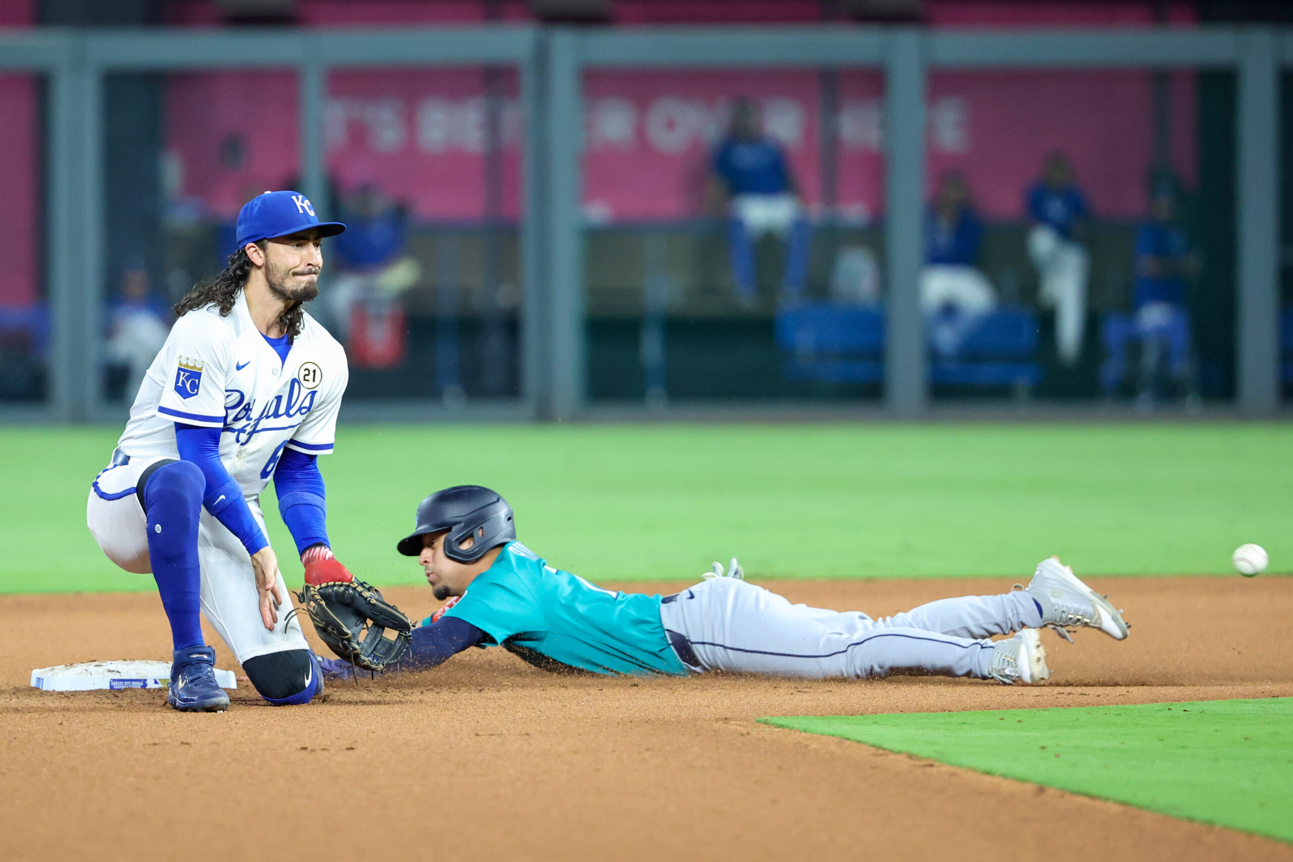 Sep 16, 2025; Kansas City, Missouri, USA; Seattle Mariners pinch running Leo Rivas (76) slides safely into second base as Kansas City Royals second baseman Jonathan India (6) fields the ball during the eighth inning at Kauffman Stadium. Mandatory Credit: Scott Sewell-Imagn Images
