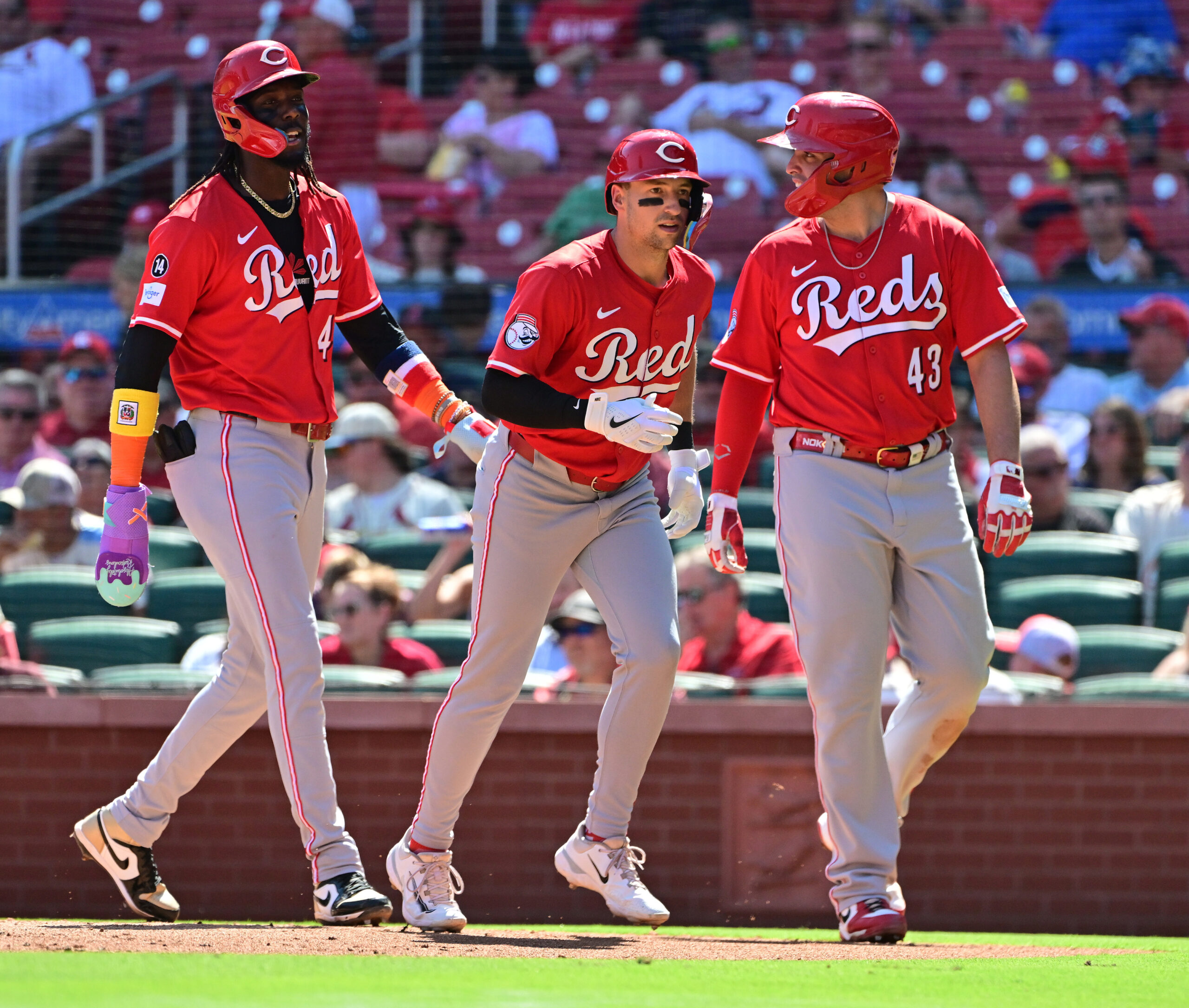 Sep 17, 2025; St. Louis, Missouri, USA; Cincinnati Reds shortstop Elly De La Cruz (44, left), Cincinnati Reds first baseman Spencer Steer (7, center), and Cincinnati Reds third baseman Sal Stewart (43) walk back to the dugout after Steer hit a three-rin home run in the fourth inning against the St. Louis Cardinals at Busch Stadium. Mandatory Credit: Tim Vizer-Imagn Images