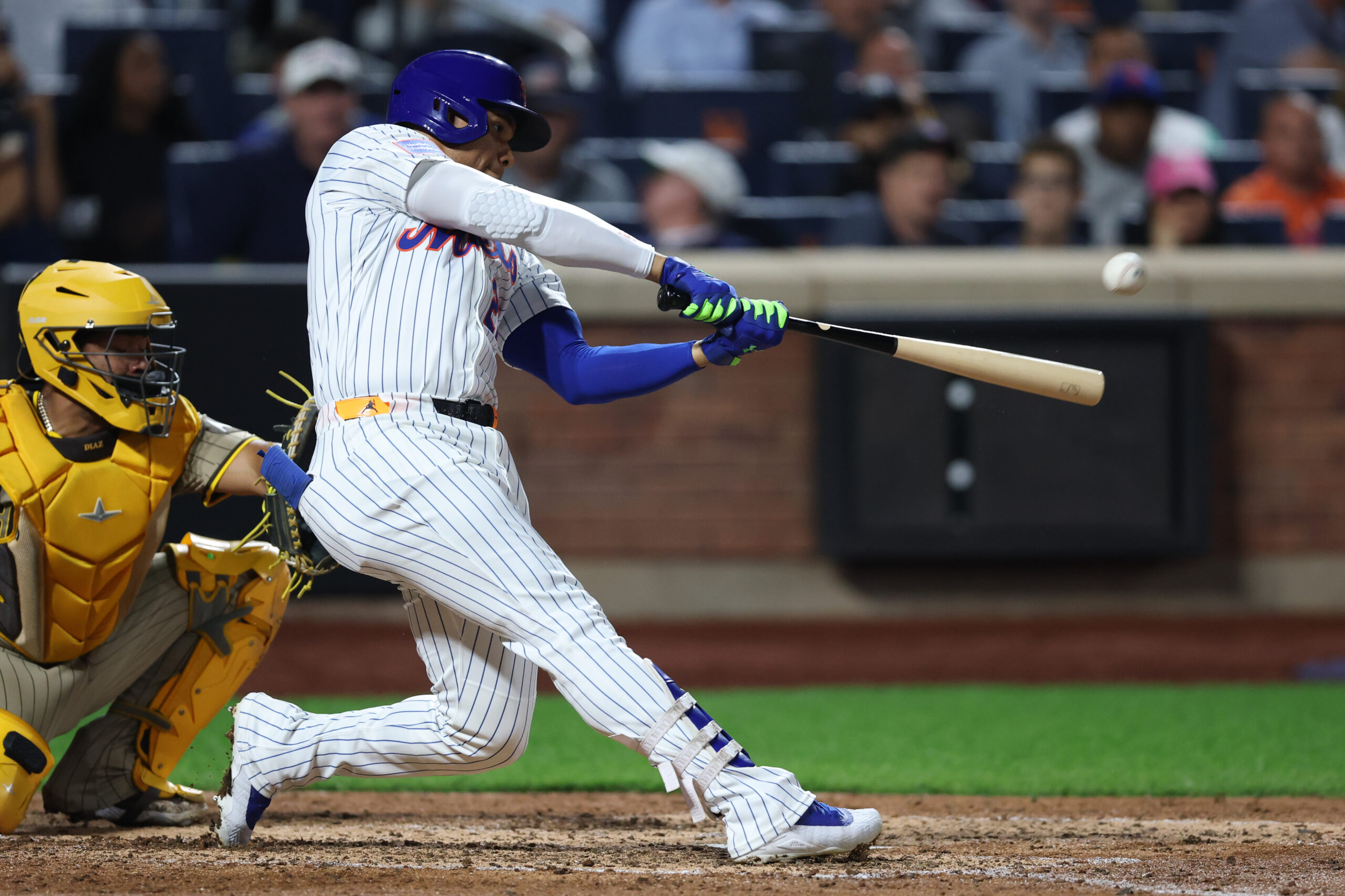 Sep 17, 2025; New York City, New York, USA; New York Mets right fielder Juan Soto (22) hits a home run during the fifth inning against the San Diego Padres at Citi Field. Mandatory Credit: Vincent Carchietta-Imagn Images