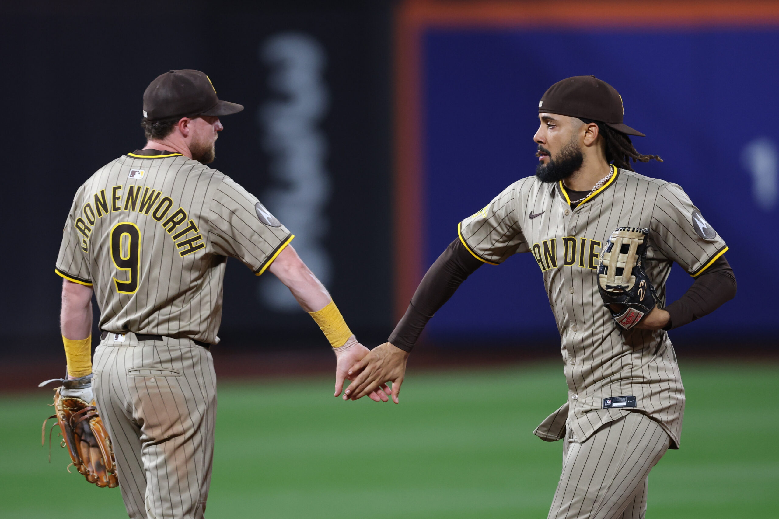 Sep 17, 2025; New York City, New York, USA; San Diego Padres second baseman Jake Cronenworth (9) celebrates with right fielder Fernando Tatis Jr. (23) after the game against the New York Mets at Citi Field. Mandatory Credit: Vincent Carchietta-Imagn Images