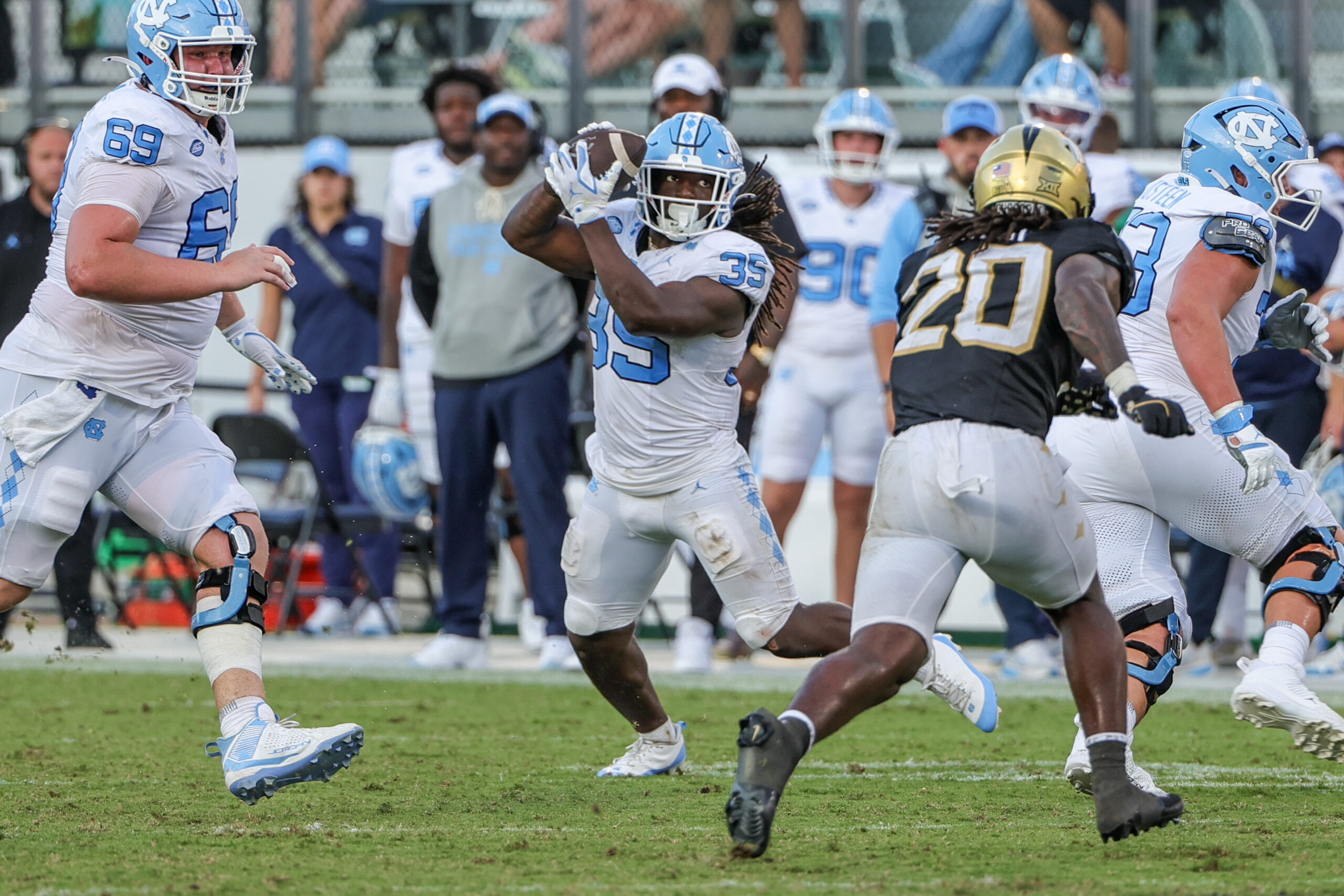 Sep 20, 2025; Orlando, Florida, USA; North Carolina Tar Heels running back Demon June (12) catches a pass during the second half against the UCF Knightsat the Bounce House Stadium. Mandatory Credit: Mike Watters-Imagn Images