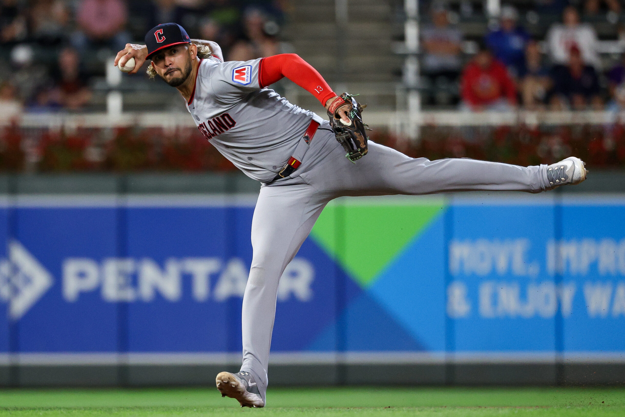 Sep 20, 2025; Minneapolis, Minnesota, USA; Cleveland Guardians shortstop Gabriel Arias (13) throws to first base to get out Minnesota Twins first baseman Edouard Julien (47) during the eighth inning of game two of a double header at Target Field. Mandatory Credit: Matt Krohn-Imagn Images