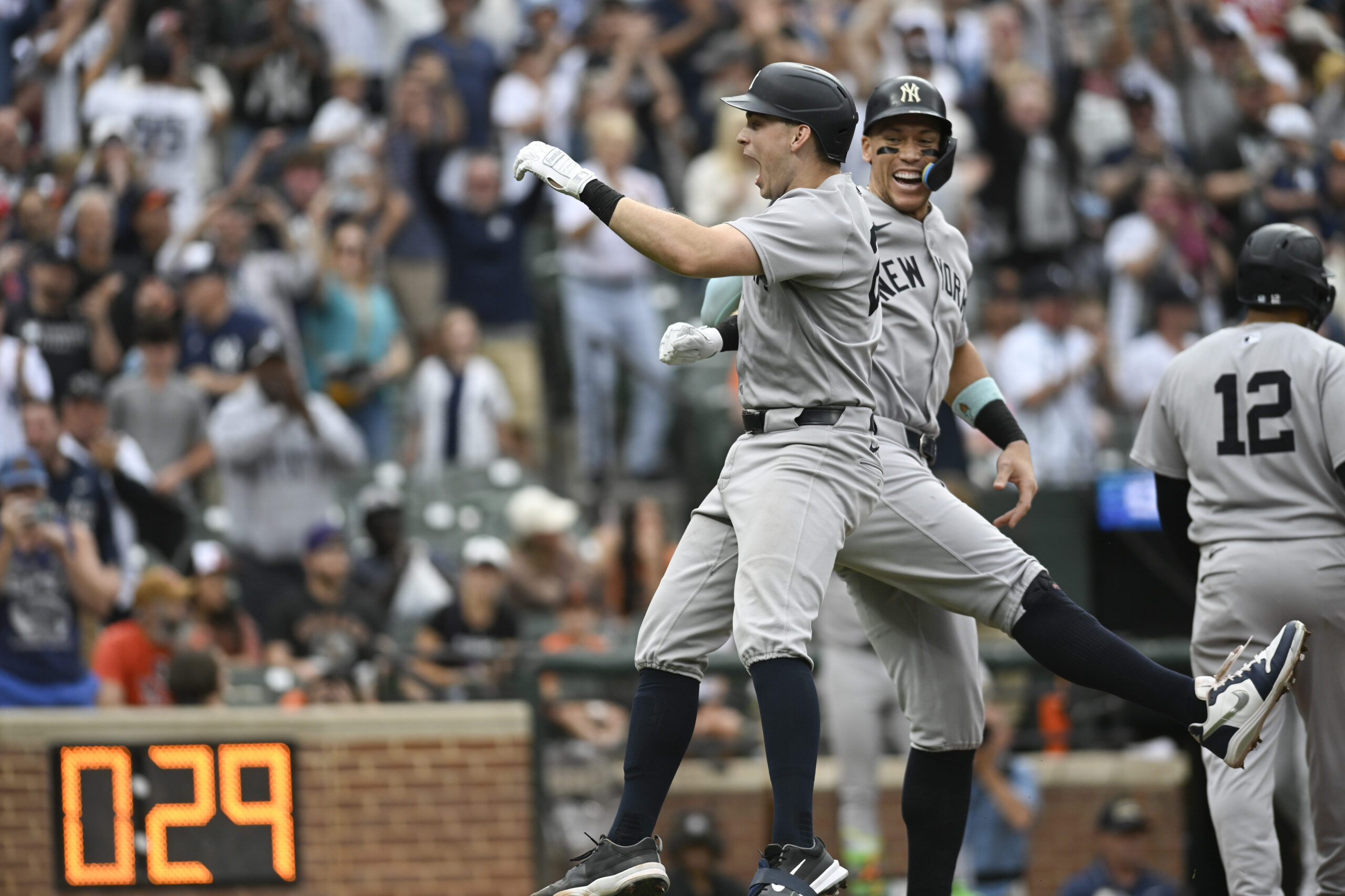 Sep 21, 2025; Baltimore, Maryland, USA;  New York Yankees first base Ben Rice (22) celebrates with designated hitter Aaron Judge (99) at home plate after hitting a tenth inning grand slam against the Baltimore Orioles at Oriole Park at Camden Yards. Mandatory Credit: Tommy Gilligan-Imagn Images