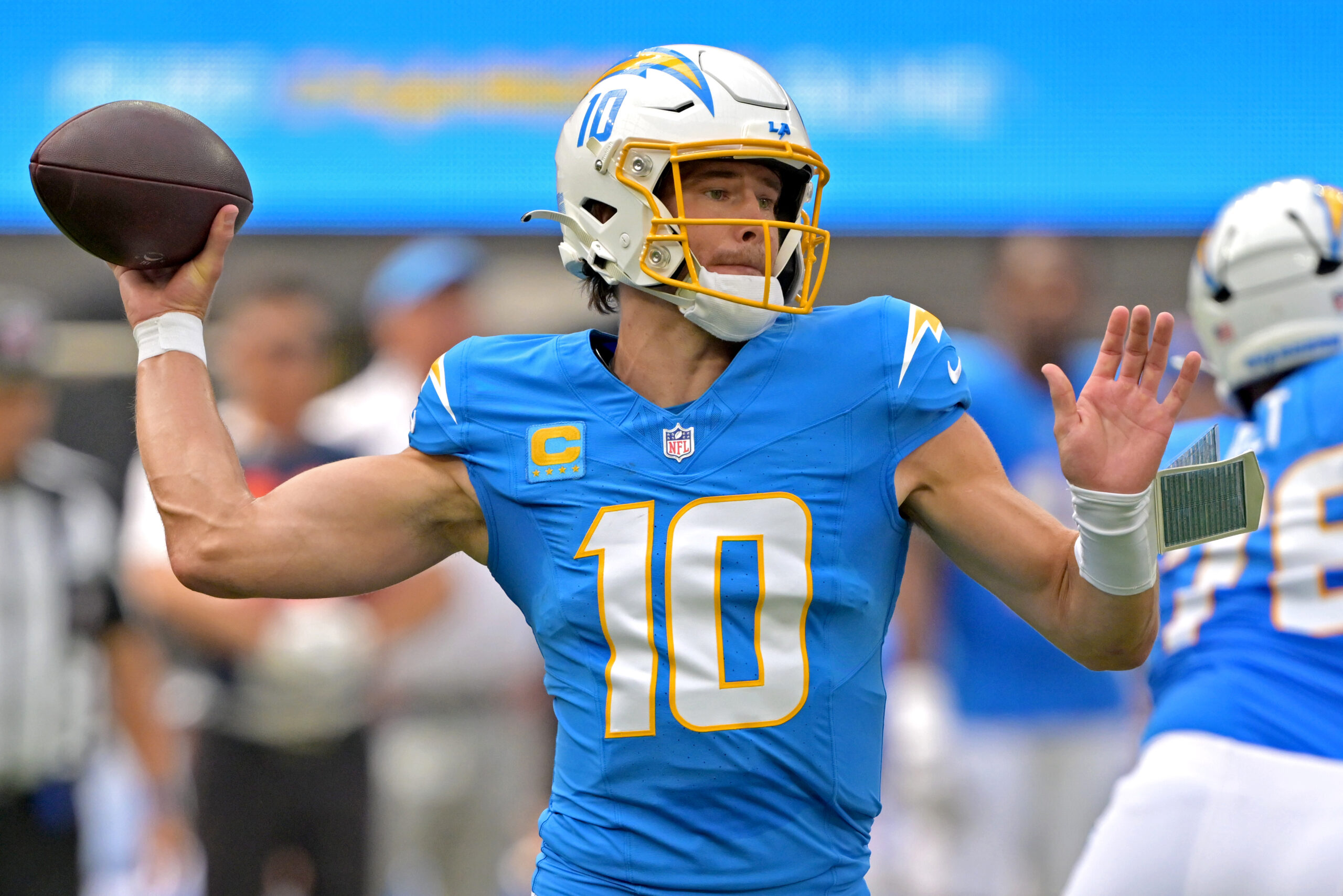 Sep 21, 2025; Inglewood, California, USA; Los Angeles Chargers quarterback Justin Herbert (10) throws a pass in the first quarter against the Denver Broncos at SoFi Stadium. Mandatory Credit: Jayne Kamin-Oncea-Imagn Images