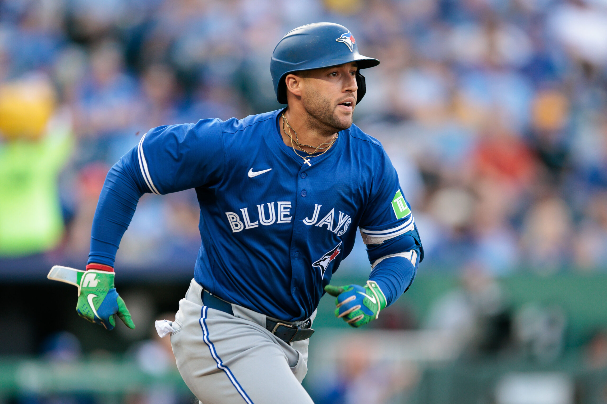 Sep 20, 2025; Kansas City, Missouri, USA; Toronto Blue Jays outfielder George Springer (4) runs to first base during the first inning against the Kansas City Royals at Kauffman Stadium. Mandatory Credit: William Purnell-Imagn Images