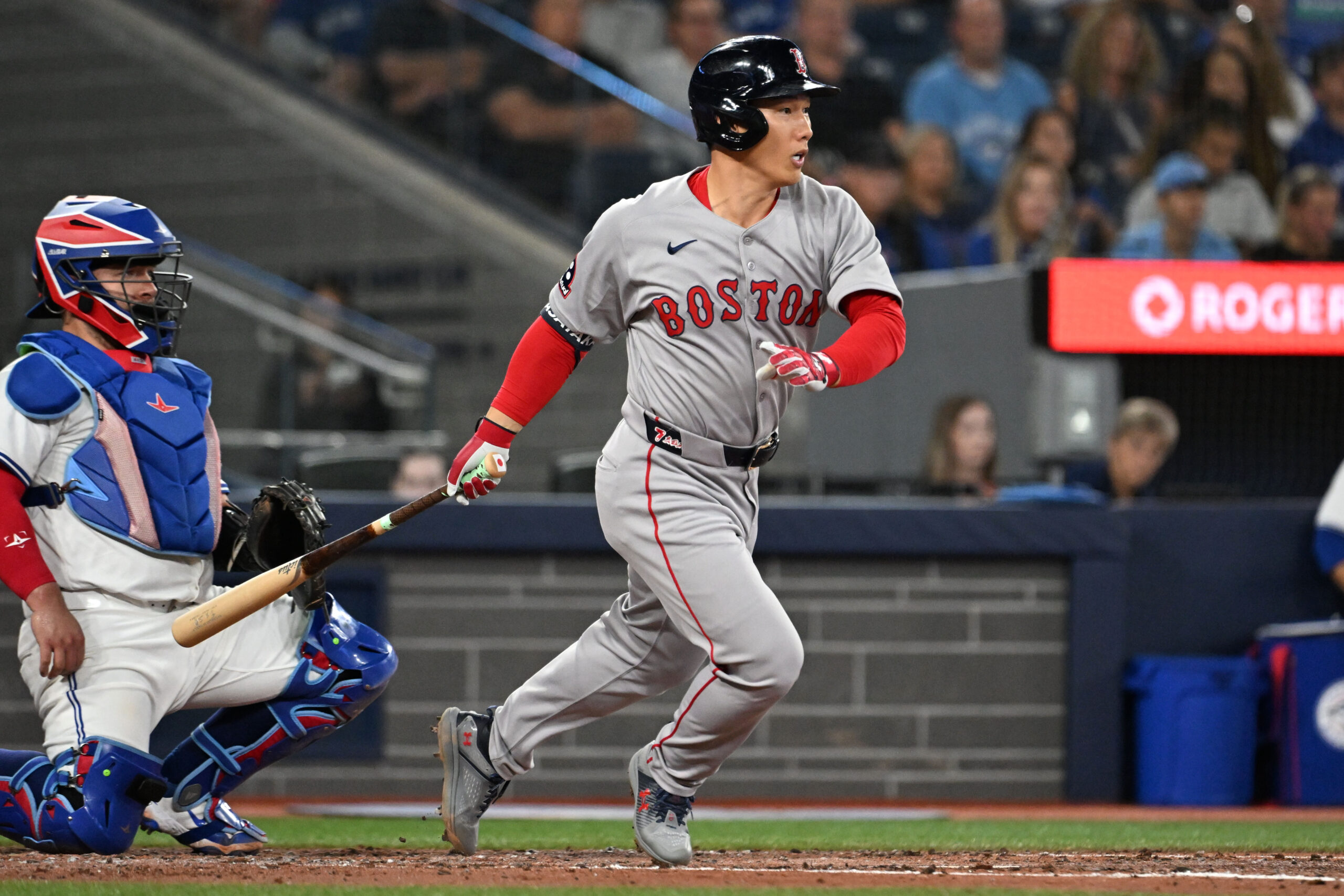 Sep 23, 2025; Toronto, Ontario, CAN;  Boston Red Sox designated hitter Masataka Yoshida (7) hits a single against the Toronto Blue Jays in the fourth inning at Rogers Centre. Mandatory Credit: Dan Hamilton-Imagn Images