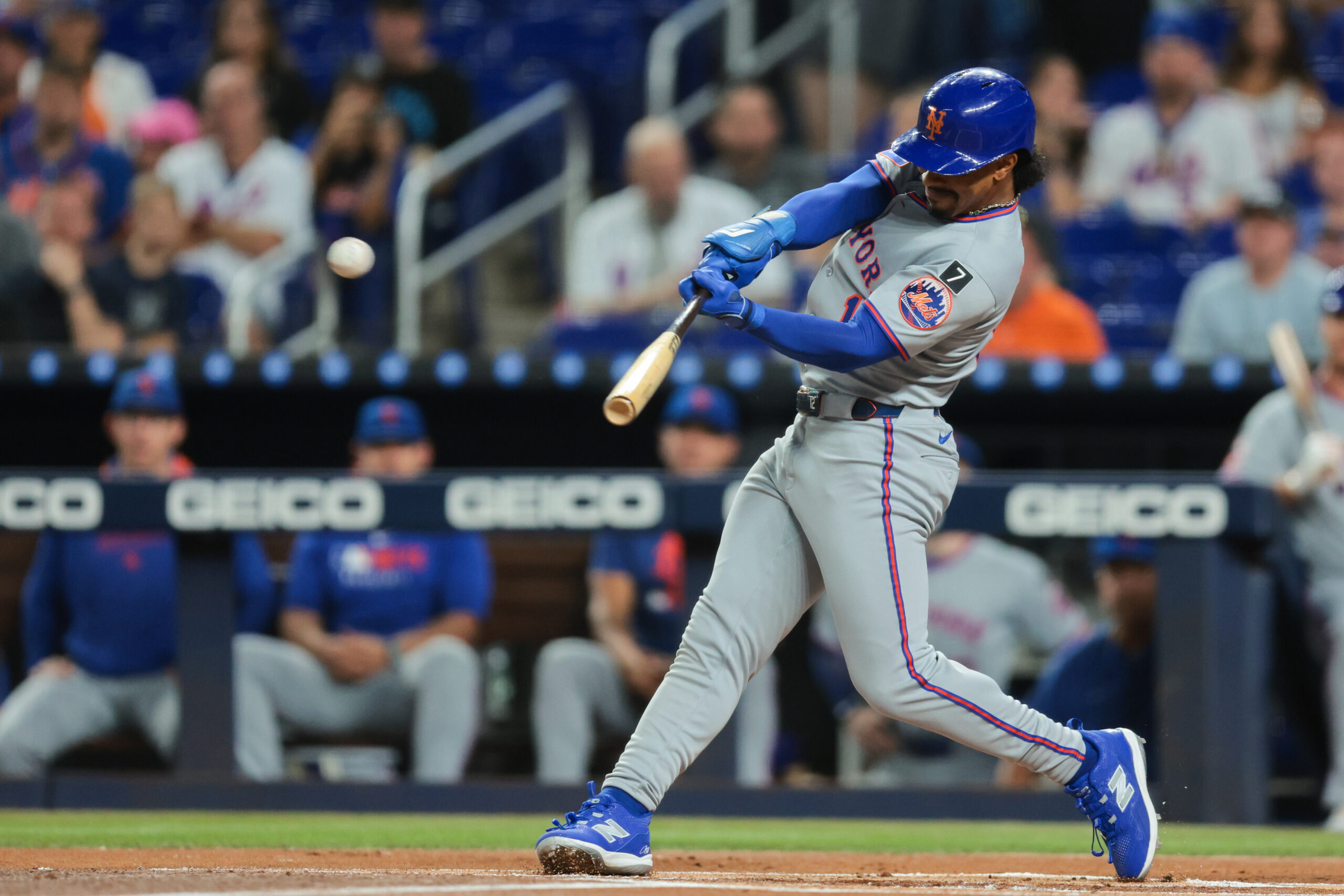 Sep 26, 2025; Miami, Florida, USA; New York Mets shortstop Francisco Lindor (12) hits a home run against the Miami Marlins during the first inning at loanDepot Park. Mandatory Credit: Sam Navarro-Imagn Images