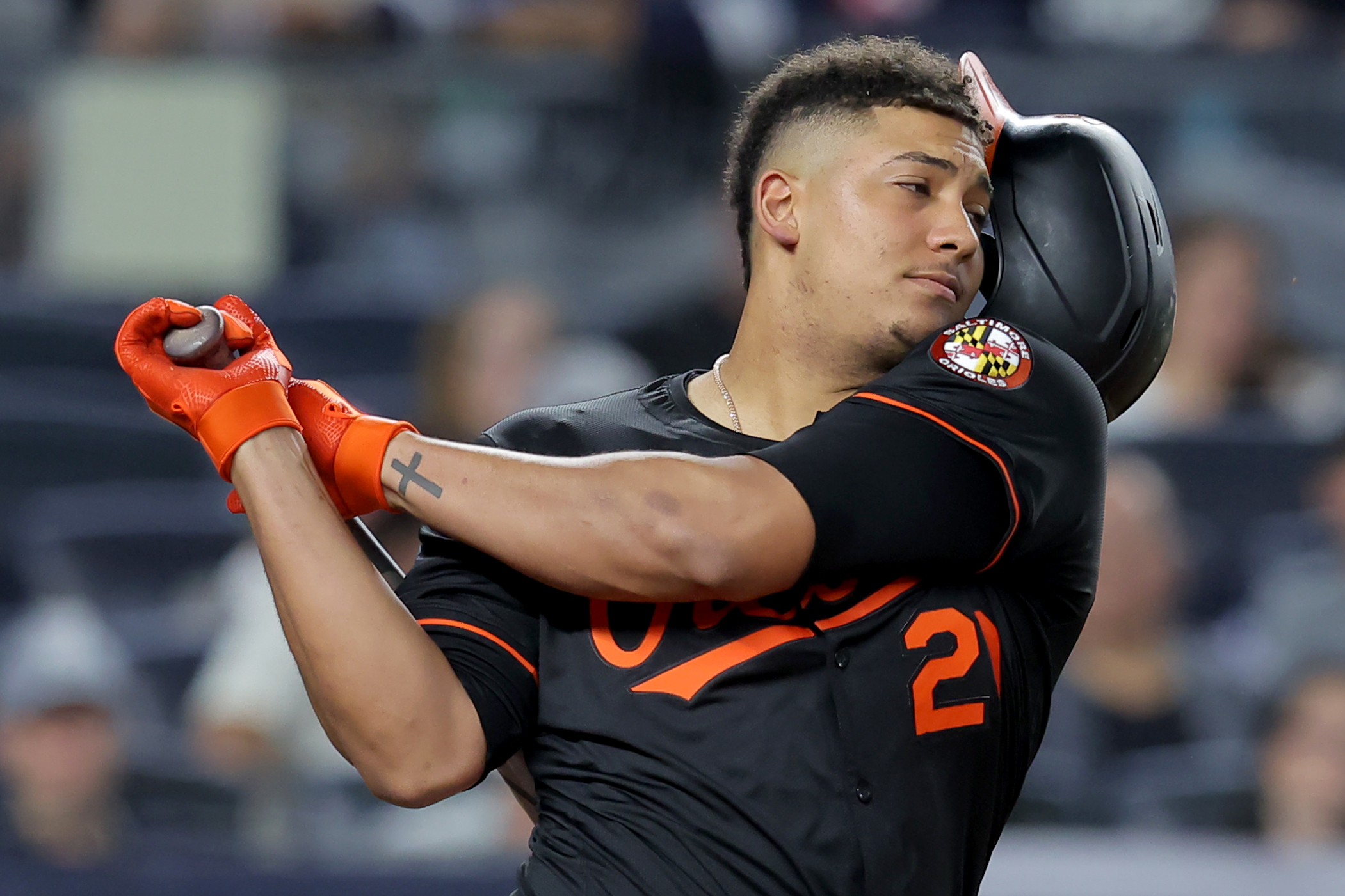 Sep 26, 2025; Bronx, New York, USA; Baltimore Orioles designated hitter Samuel Basallo (29) loses his helmet while swinging at a pitch during the sixth inning against the New York Yankees at Yankee Stadium. Mandatory Credit: Brad Penner-Imagn Images