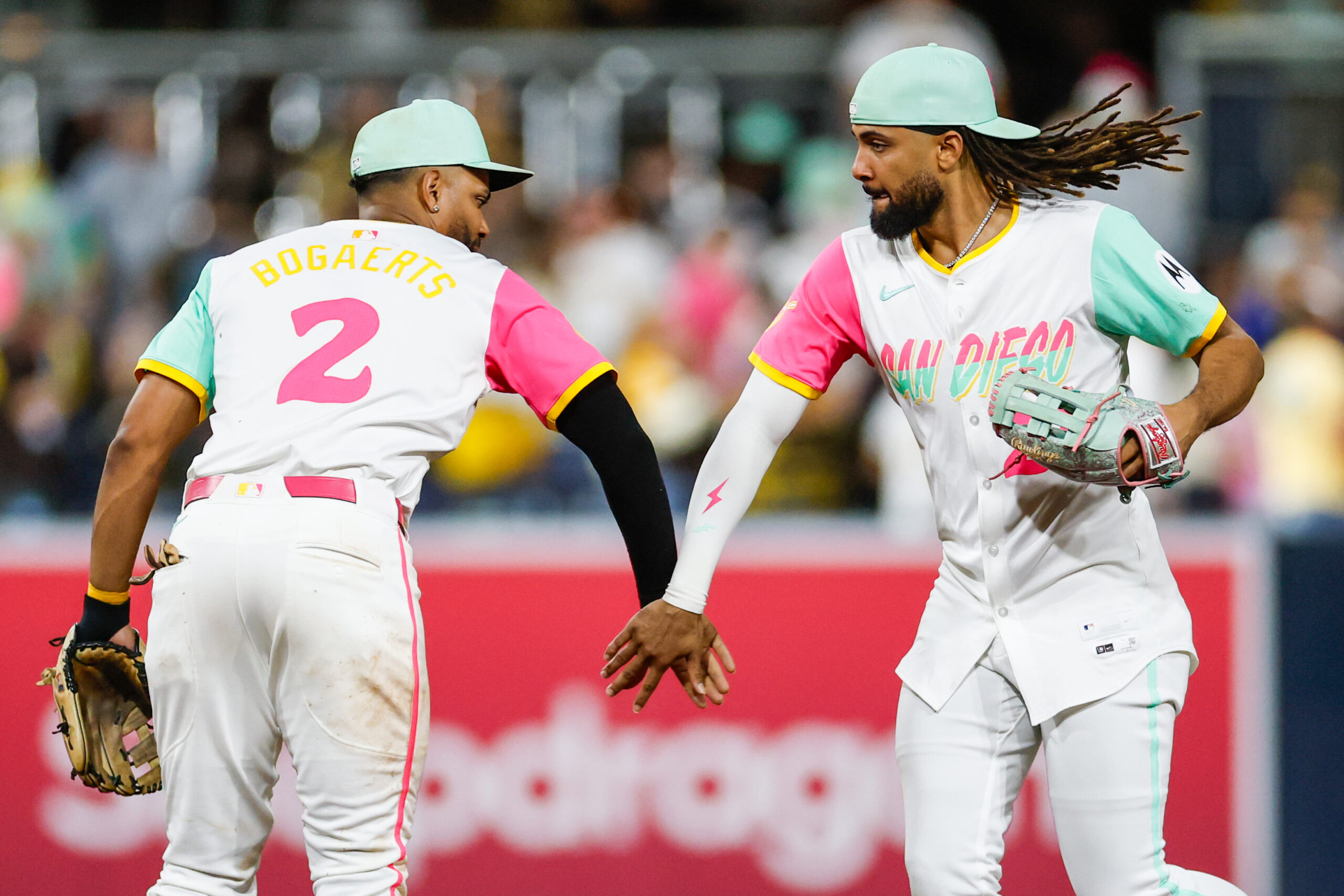 Sep 26, 2025; San Diego, California, USA; San Diego Padres right fielder Fernando Tatis Jr. (23) celebrates with shortstop Xander Bogaerts (2) after defeating the Arizona Diamondbacks at Petco Park. Mandatory Credit: David Frerker-Imagn Images