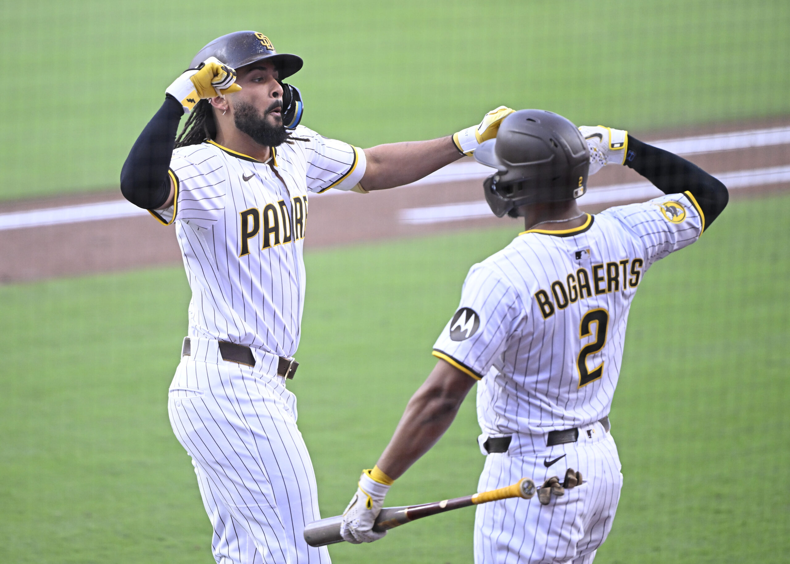 Sep 27, 2025; San Diego, California, USA; San Diego Padres right fielder Fernando Tatis Jr. (23) is congratulated by Luis Arraez (4) after hitting a solo home run during the first inning against the Arizona Diamondbacks at Petco Park. Mandatory Credit: Denis Poroy-Imagn Images