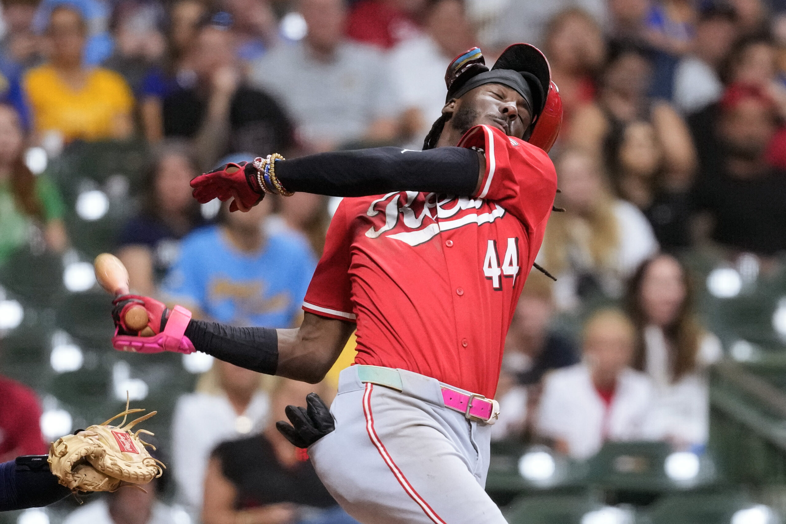 Sep 27, 2025; Milwaukee, Wisconsin, USA;  Cincinnati Reds shortstop Elly De La Cruz (44) loses his helmet while striking out during the ninth inning against the Milwaukee Brewers at American Family Field. Mandatory Credit: Jeff Hanisch-Imagn Images