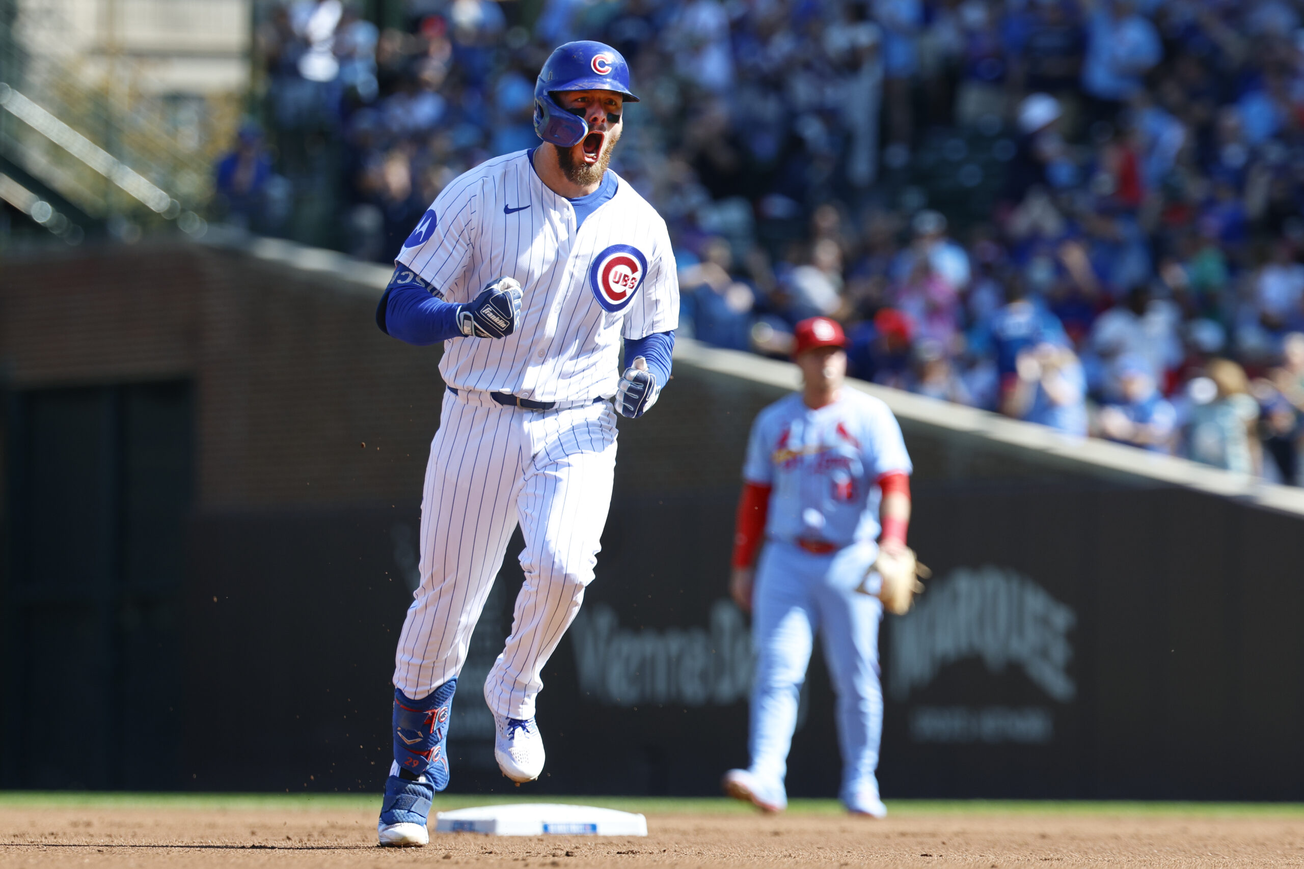 Sep 27, 2025; Chicago, Illinois, USA; Chicago Cubs first baseman Michael Busch (29) rounds the bases after hitting a solo home run against the St. Louis Cardinals during the first inning at Wrigley Field. Mandatory Credit: Kamil Krzaczynski-Imagn Images