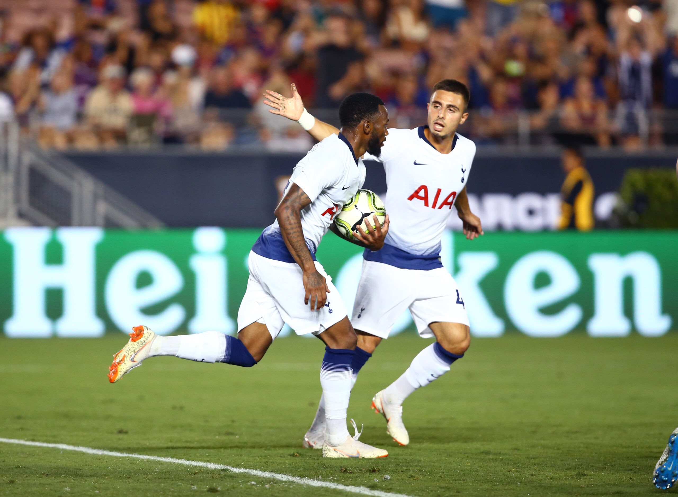 Jul 28, 2018; Pasadena, CA, USA; Tottenham Hotspur midfielder Georges-Kevin N'Koudou (left) celebrates his second half goal with midfielder Anthony Georgiou (42) against FC Barcelona during an International Champions Cup soccer match at Rose Bowl. Mandatory Credit: Mark J. Rebilas-Imagn Images