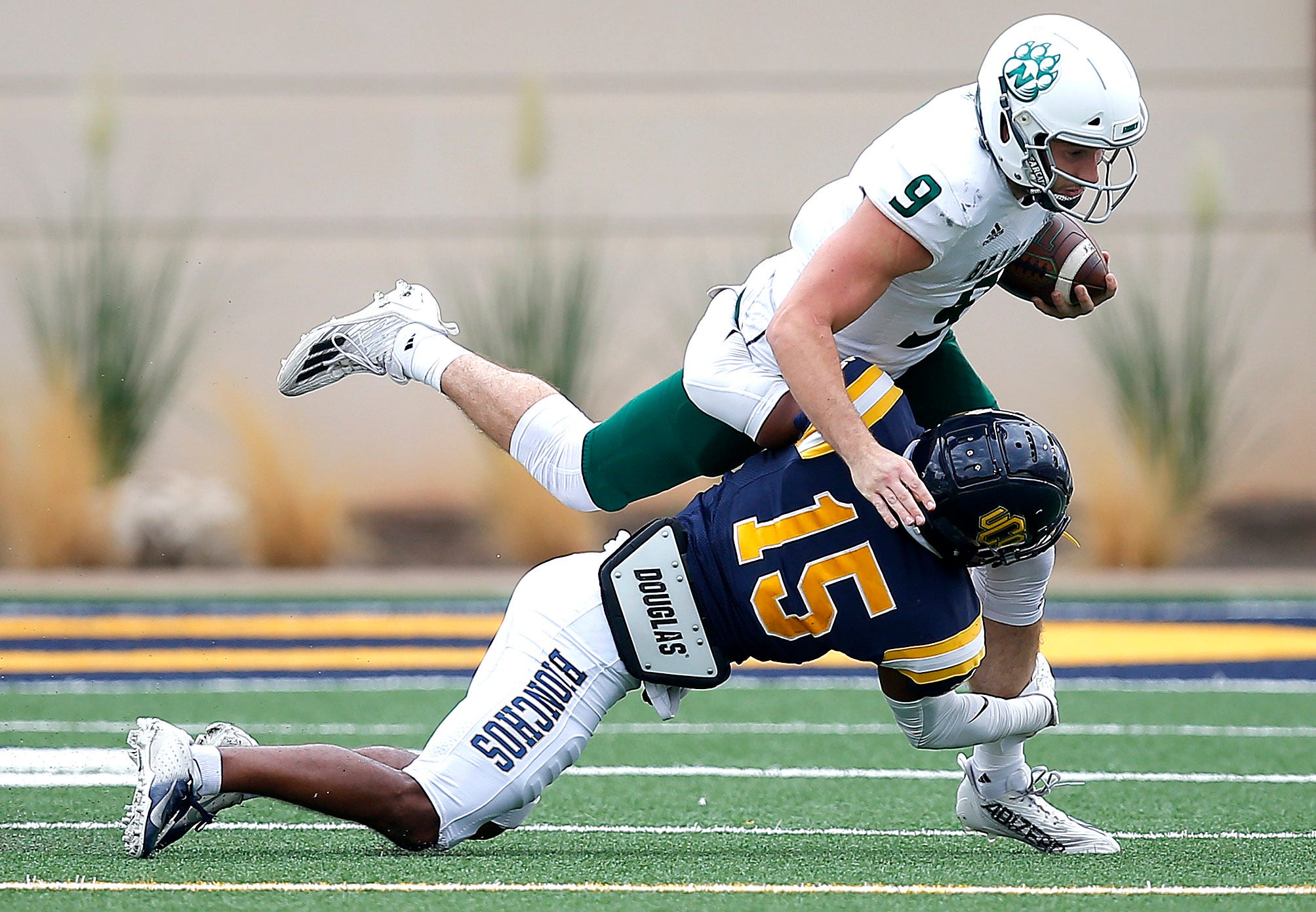 Central Oklahoma's Rae'quan Wicks tackles Northwest Missouri's Mike Hohensee during the the college football game between the University of Central Oklahoma Bronchos and the Northwest Missouri State Bearcats at the Chad Richison Stadium in Edmond, Okla., Saturday, Sept., 24, 2022. UCO beat Northwest Missouri 23 to 14.

Uco Vs Nwmsu Fb