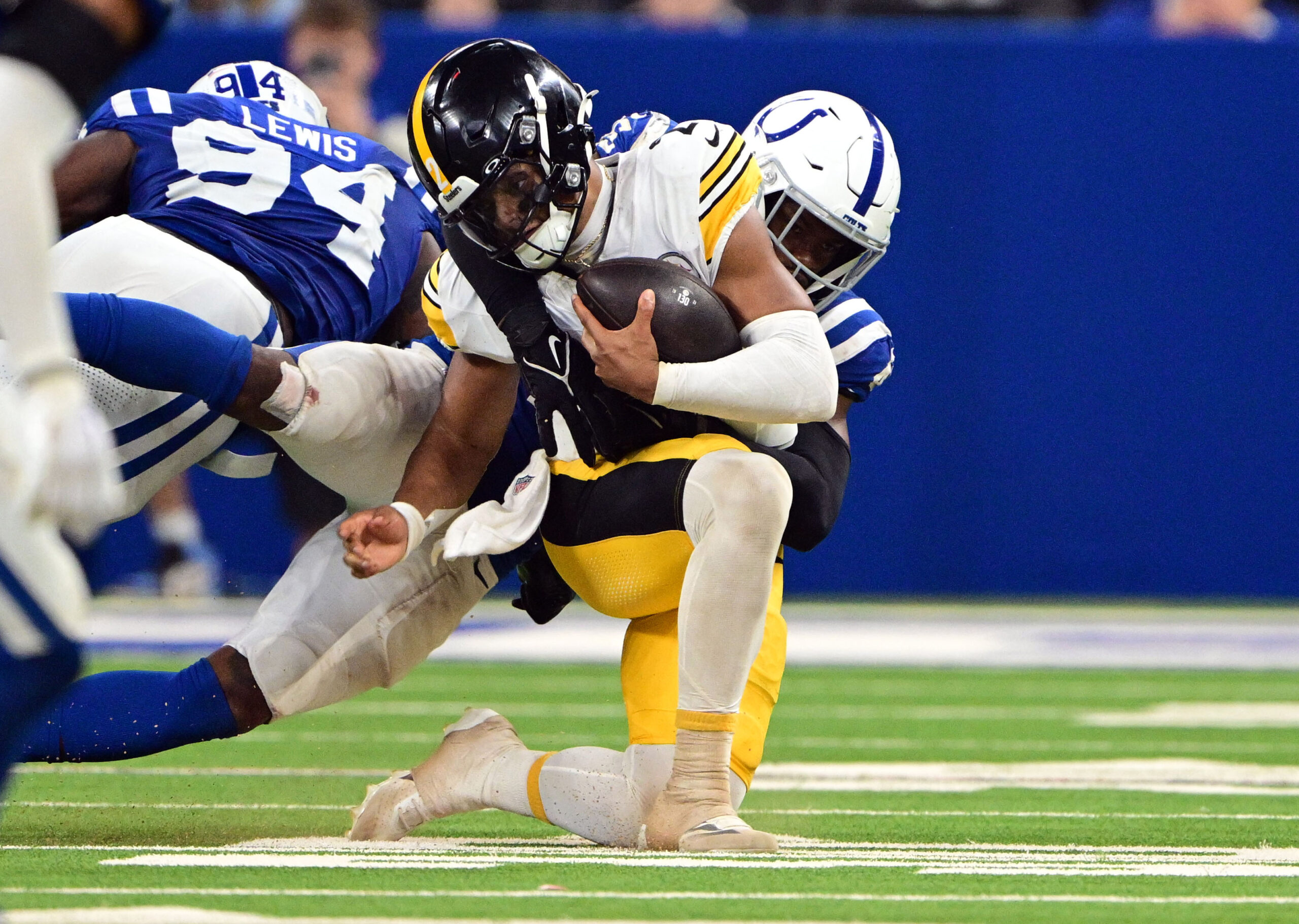 Sep 29, 2024; Indianapolis, Indiana, USA; Indianapolis Colts defensive end Tyquan Lewis (94) and linebacker E.J. Speed (45) sack Pittsburgh Steelers quarterback Justin Fields (2) during the second half at Lucas Oil Stadium. Mandatory Credit: Marc Lebryk-Imagn Images