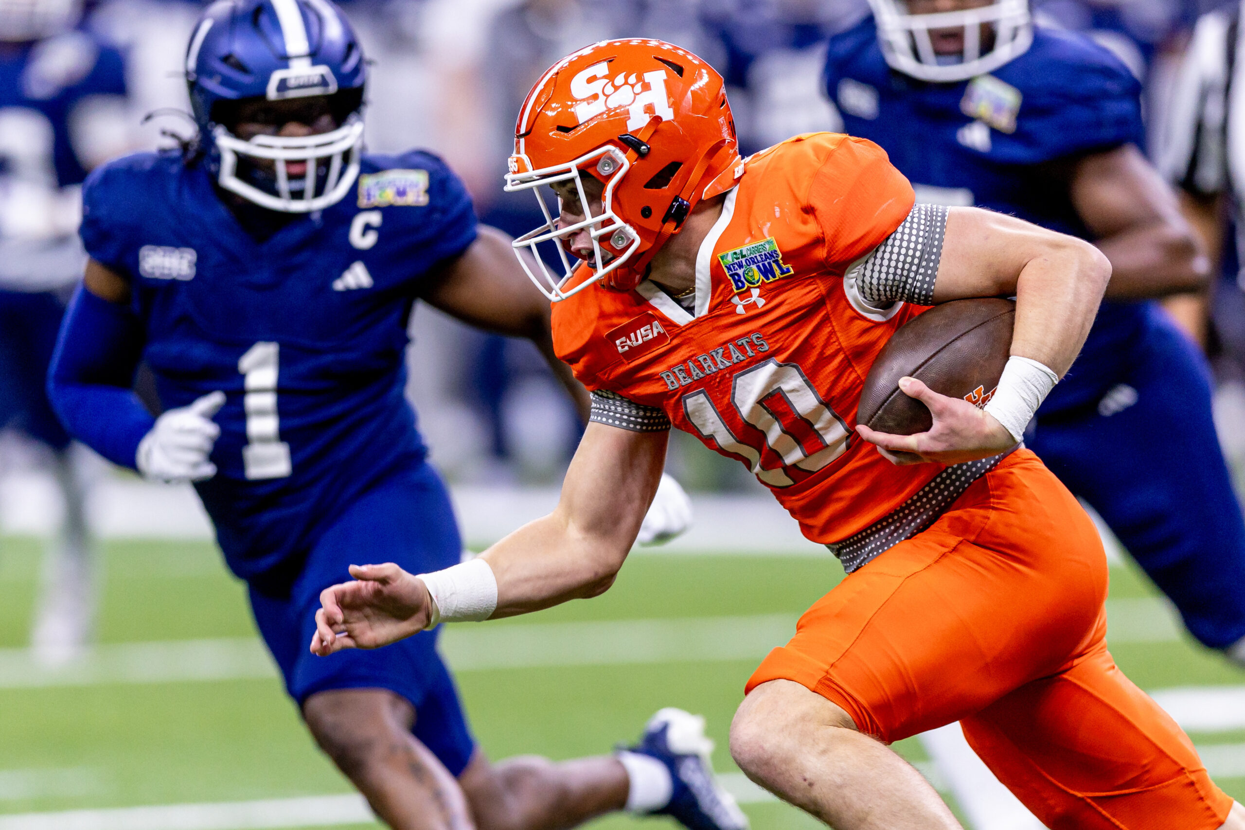 Dec 19, 2024; New Orleans, LA, USA;  Sam Houston State Bearkats quarterback Hunter Watson (10) scrambles against the Georgia Southern Eagles during the first half at Caesars Superdome. Mandatory Credit: Stephen Lew-Imagn Images