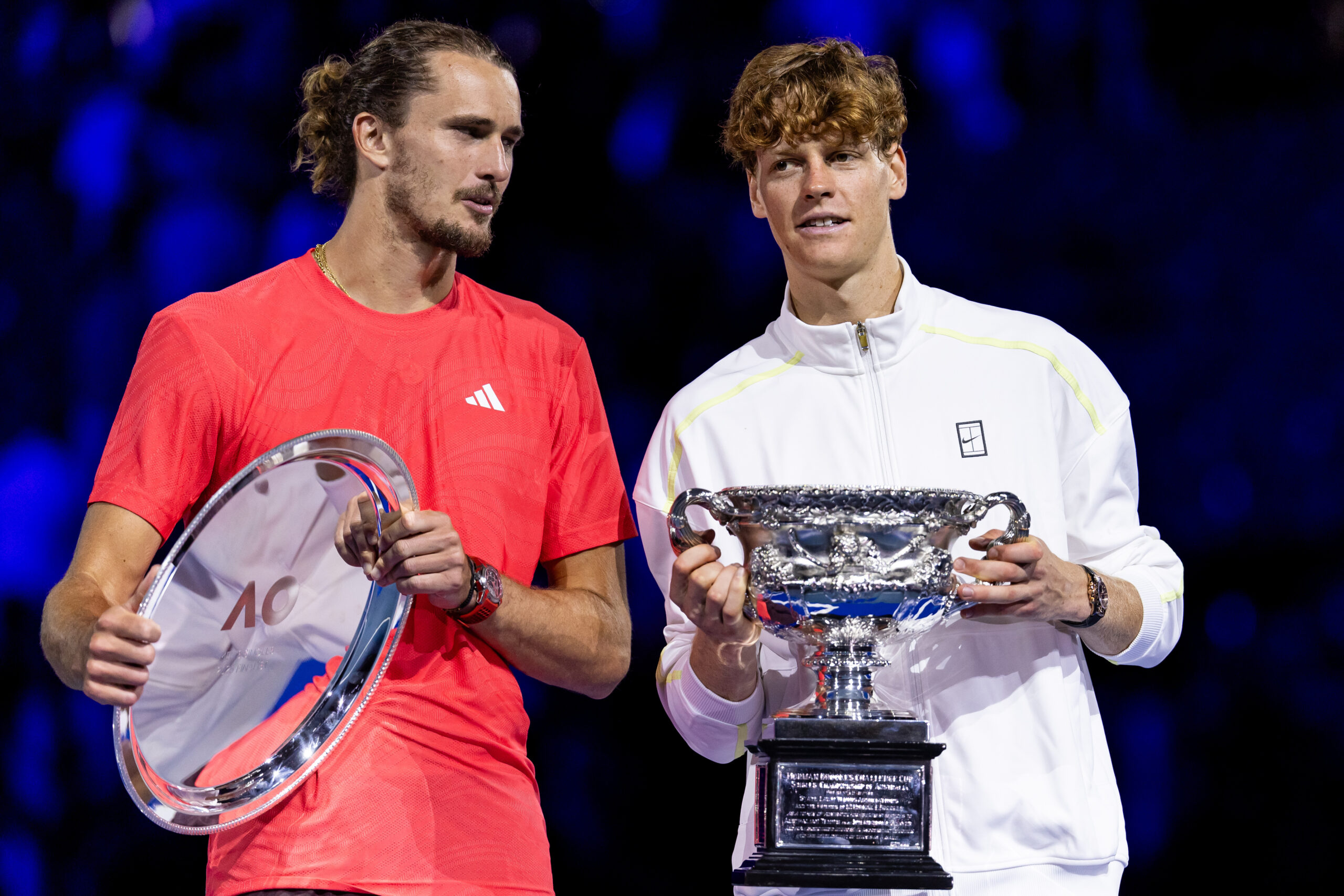Jan 26, 2025; Melbourne, Victoria, Australia; Jannik Sinner of Italy and Alexander Zverev of Germany share a moment during the prize presentation of the men's single final at the 2025 Australian Open at Melbourne Park. Mandatory Credit: Mike Frey-Imagn Images