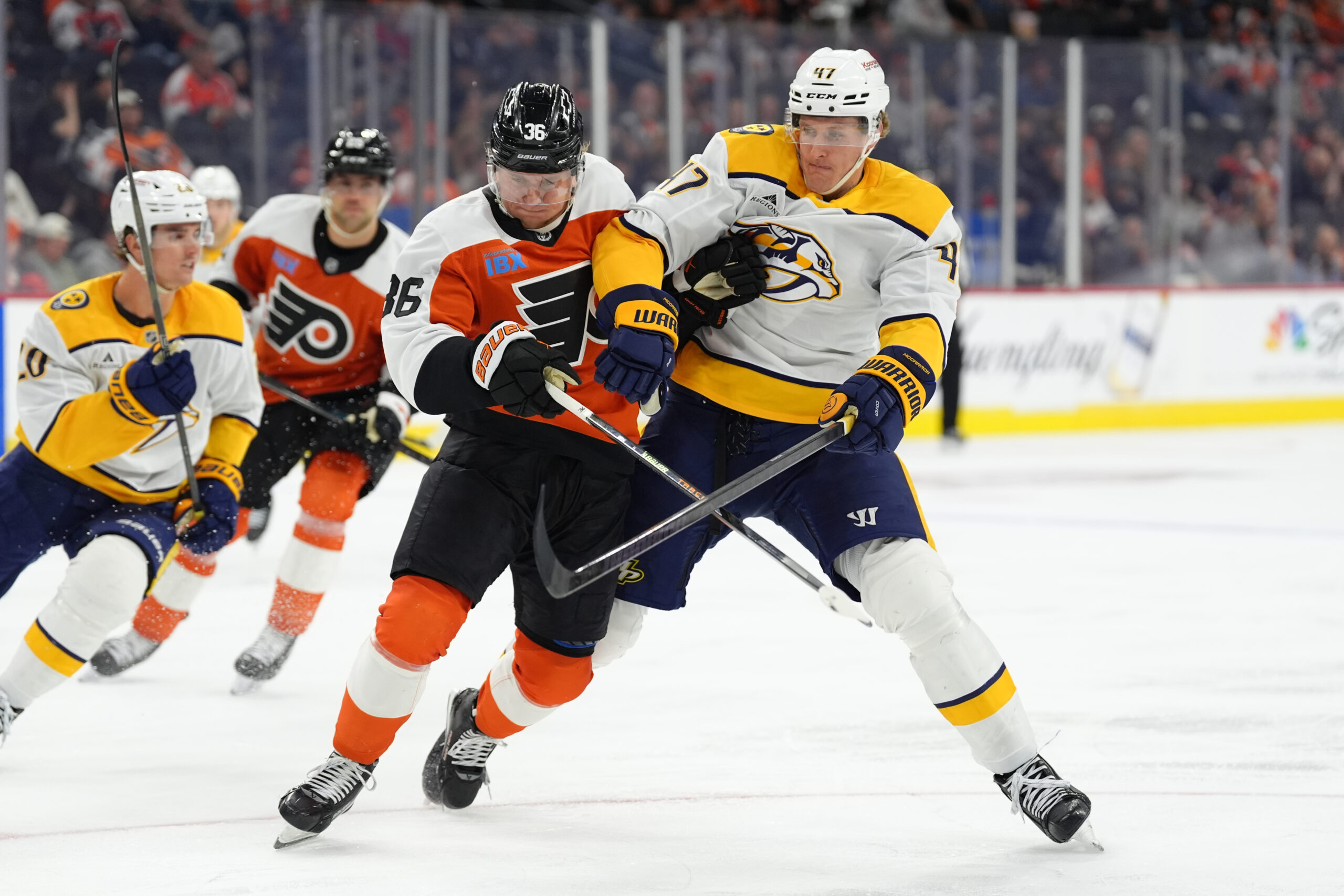 Mar 31, 2025; Philadelphia, Pennsylvania, USA; Philadelphia Flyers defenseman Emil Andrae (36) and Nashville Predators right wing Michael McCarron (47) battle for position in the third period at Wells Fargo Center. Mandatory Credit: Kyle Ross-Imagn Images