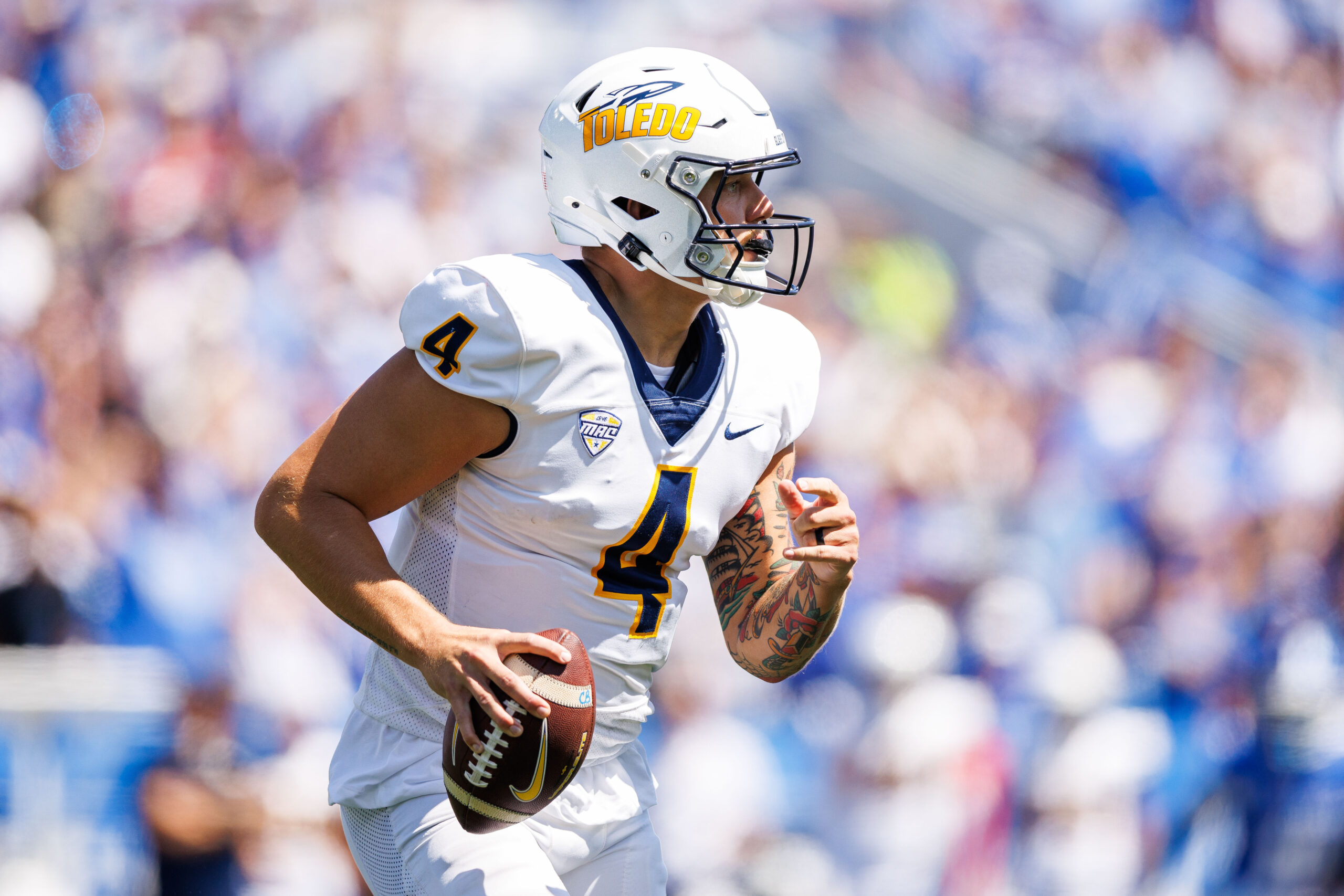 Aug 30, 2025; Lexington, Kentucky, USA; Toledo Rockets quarterback Tucker Gleason (4) looks to pass during the first quarter against the Kentucky Wildcats at Kroger Field. Mandatory Credit: Jordan Prather-Imagn Images