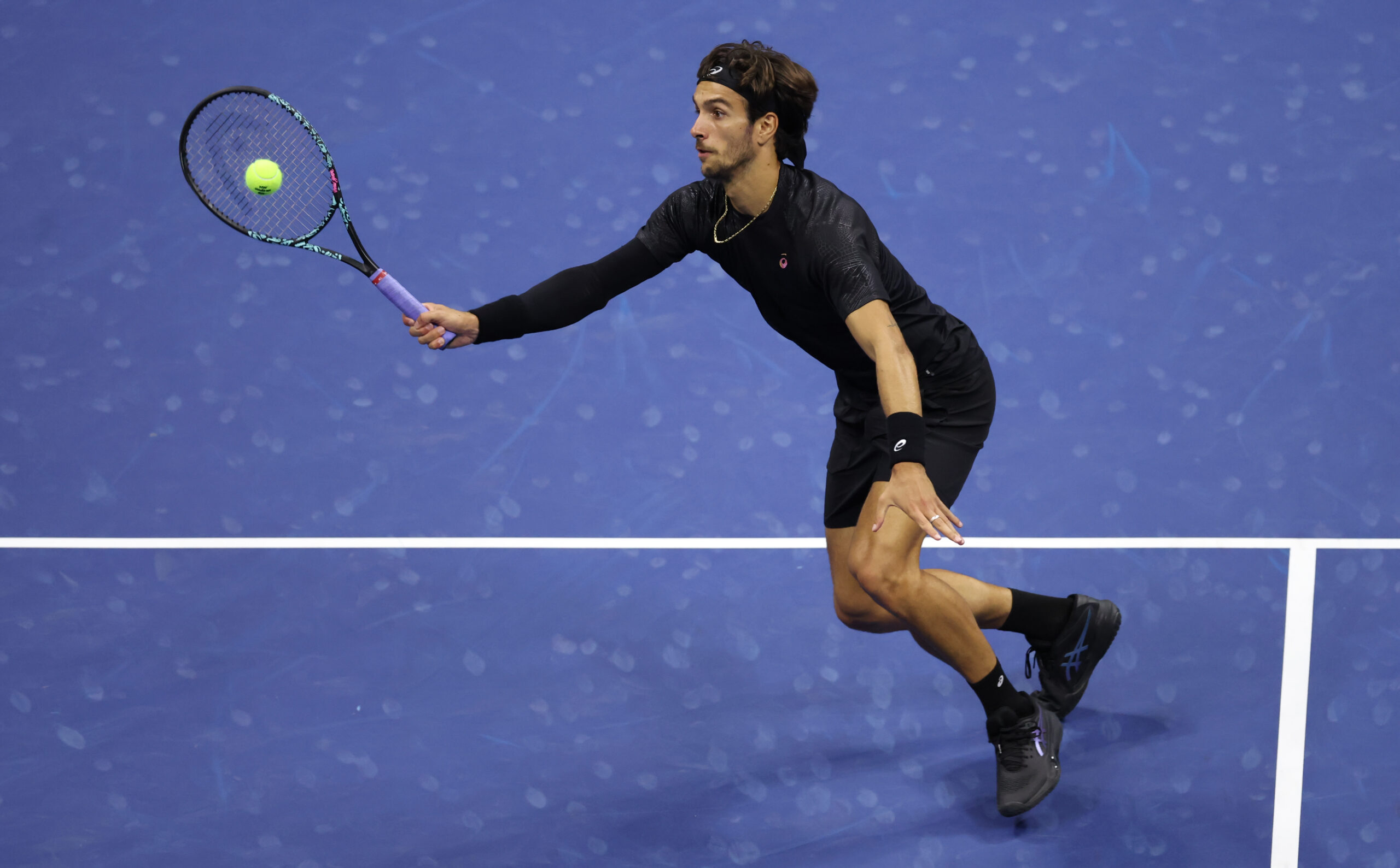 Sep 3, 2025; Flushing, NY, USA; Lorenzo Musetti (ITA) hits a shot against Jannik Sinner (ITA) (not pictured) on day eleven of the 2025 US Open tennis championships at USTA Billie Jean King National Tennis Center. Mandatory Credit: Mike Frey-Imagn Images