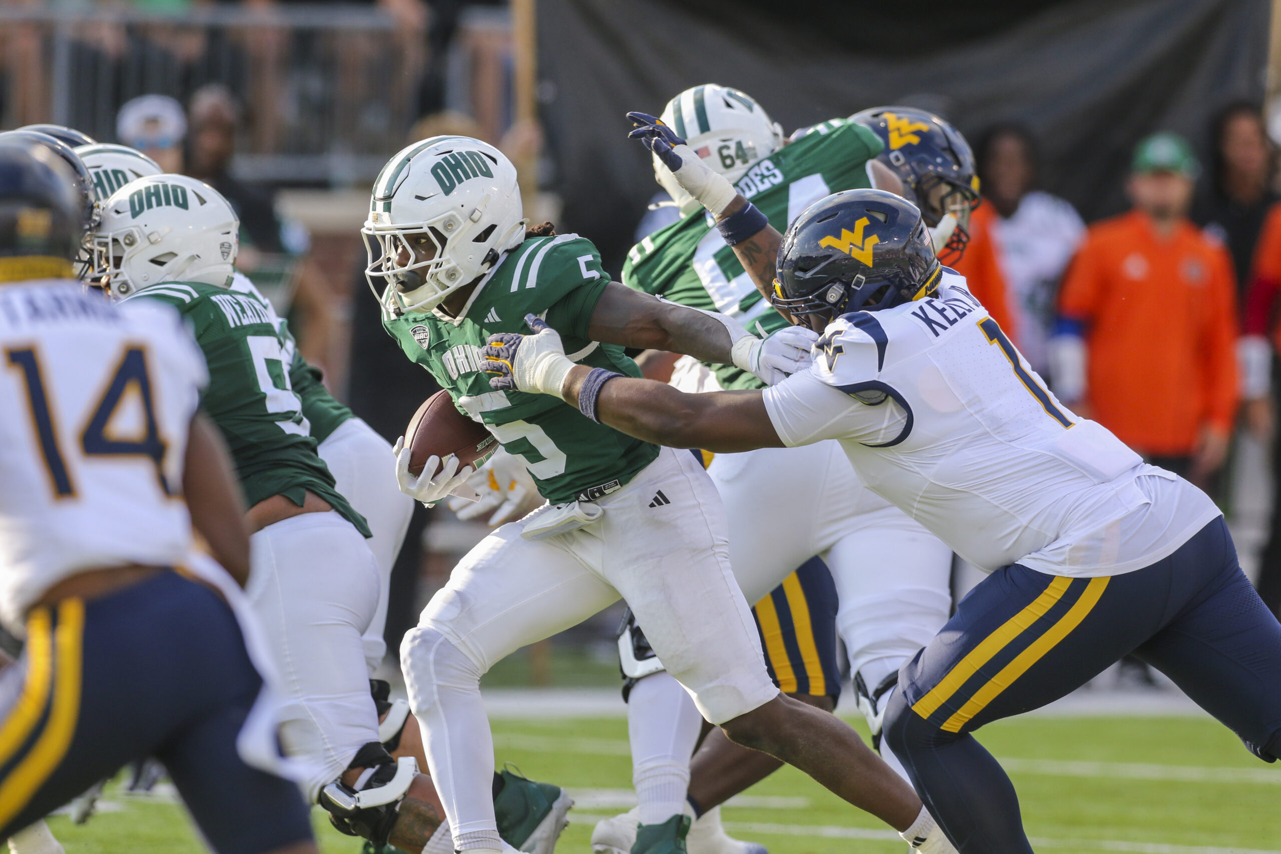 Sep 6, 2025; Athens, Ohio, USA; Ohio Bobcats running back Sieh Bangura (5) runs the ball during the third quarter against the West Virginia Mountaineers at Peden Stadium. Mandatory Credit: Ben Queen-Imagn Images