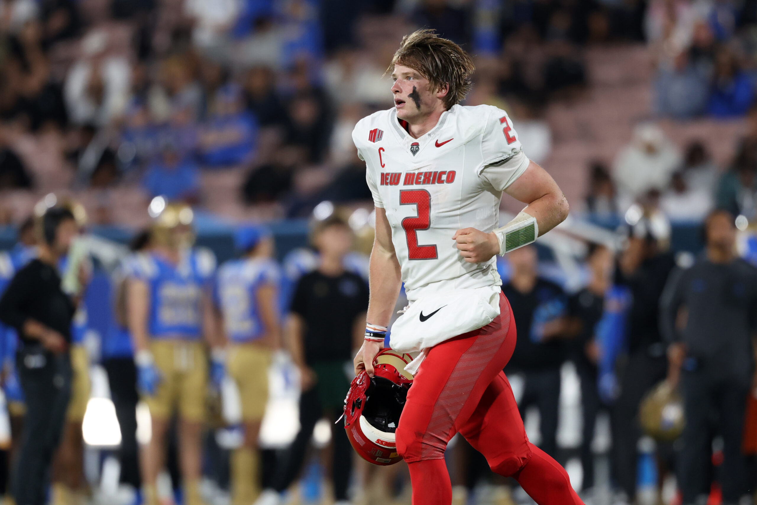 Sep 12, 2025; Pasadena, California, USA;  New Mexico Lobos quarterback Jack Layne (2) runs back to the sideline during the second quarter against the UCLA Bruins at Rose Bowl. Mandatory Credit: Kiyoshi Mio-Imagn Images