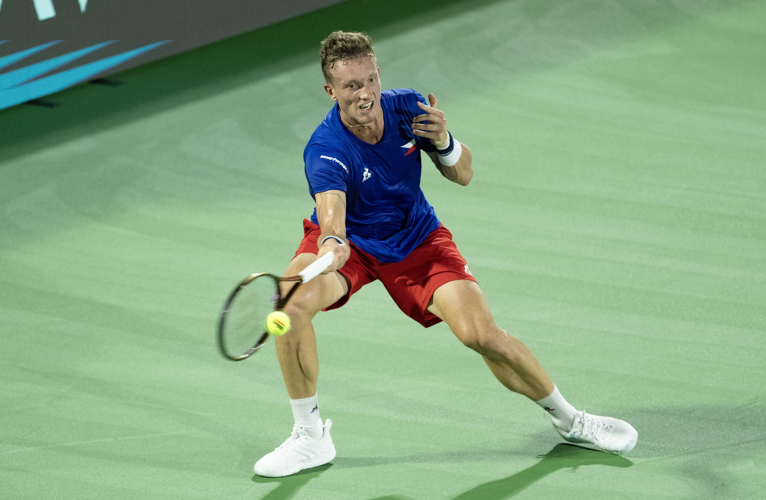 Sep 13, 2025; Delray Beach, FL, USA; Jiri Lehecka of Czechia returns a shot against Taylor Fritz of the United States in their Davis Cup match at Delray Beach Tennis Center. Mandatory Credit: Susan Mullane-Imagn Images