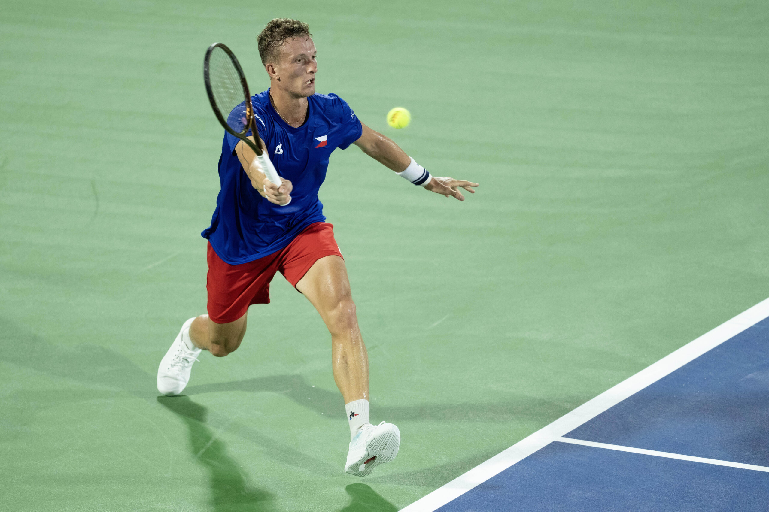 Sep 13, 2025; Delray Beach, FL, USA; Jiri Lehecka of Czechia returns a shot against Taylor Fritz of the United States in their Davis Cup match at Delray Beach Tennis Center. Mandatory Credit: Susan Mullane-Imagn Images