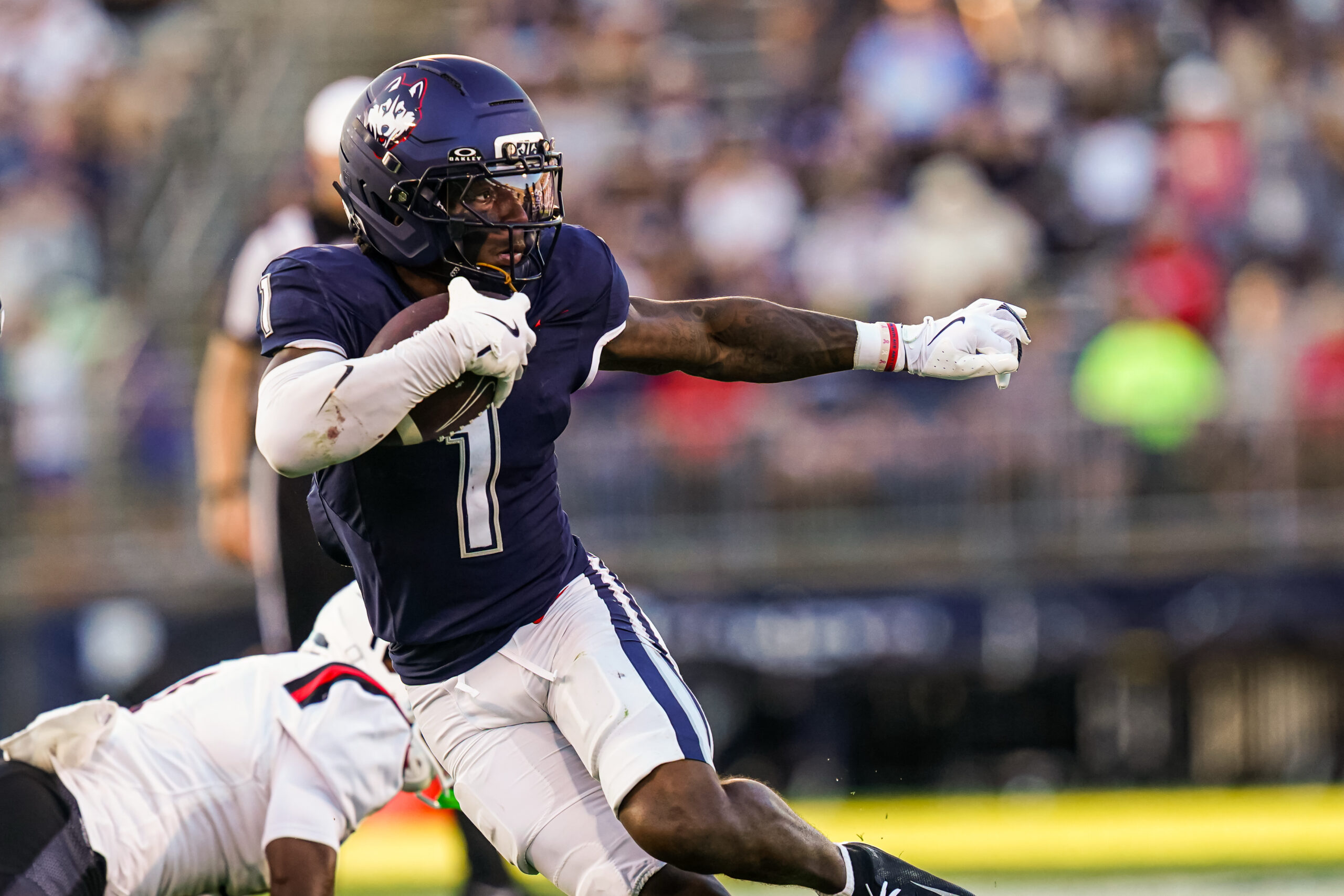 Sep 20, 2025; East Hartford, Connecticut, USA; Connecticut Huskies wide receiver Skyler Bell (1) runs the ball against et Ball State Cardinals in the second half at Pratt & Whitney Stadium at Rentschler Field. Mandatory Credit: David Butler II-Imagn Images