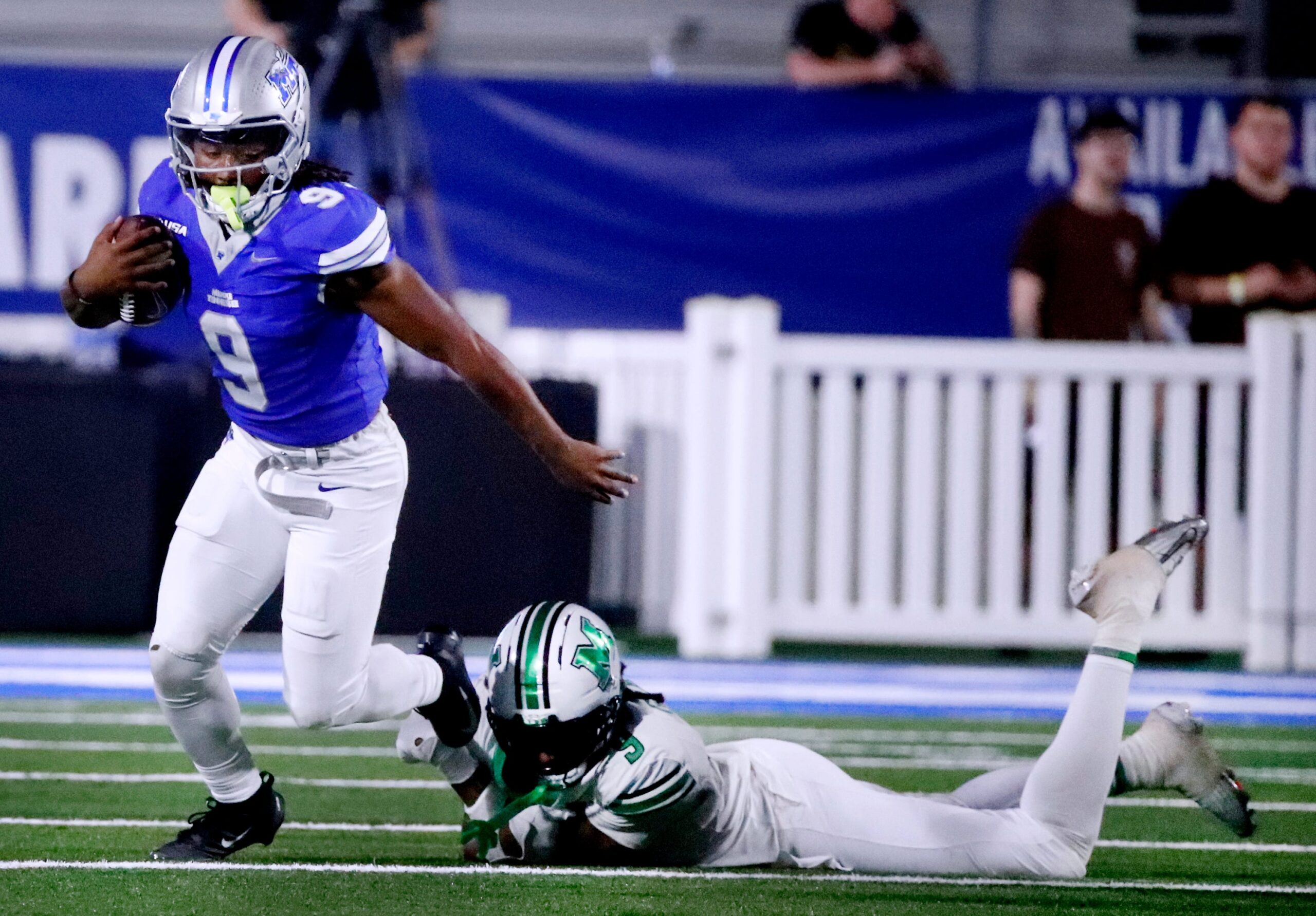 Middle Tennessee running back Jekail Middlebrook (9) deflects a tackle from Marshall linebacker Javae Gilmore (9) during MTSU's Homecoming football game on Saturday, Sept. 20, 2025.