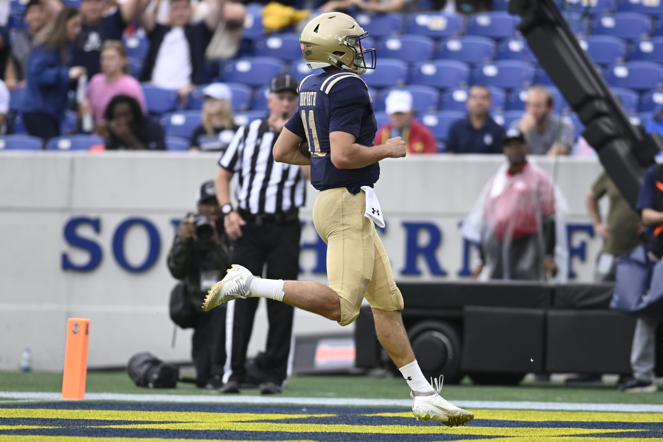 Sep 27, 2025; Annapolis, Maryland, USA;  Navy Midshipmen quarterback Blake Horvath (11) scores a first half touchdown against the Rice Owls at Navy-Marine Corps Memorial Stadium. Mandatory Credit: Tommy Gilligan-Imagn Images