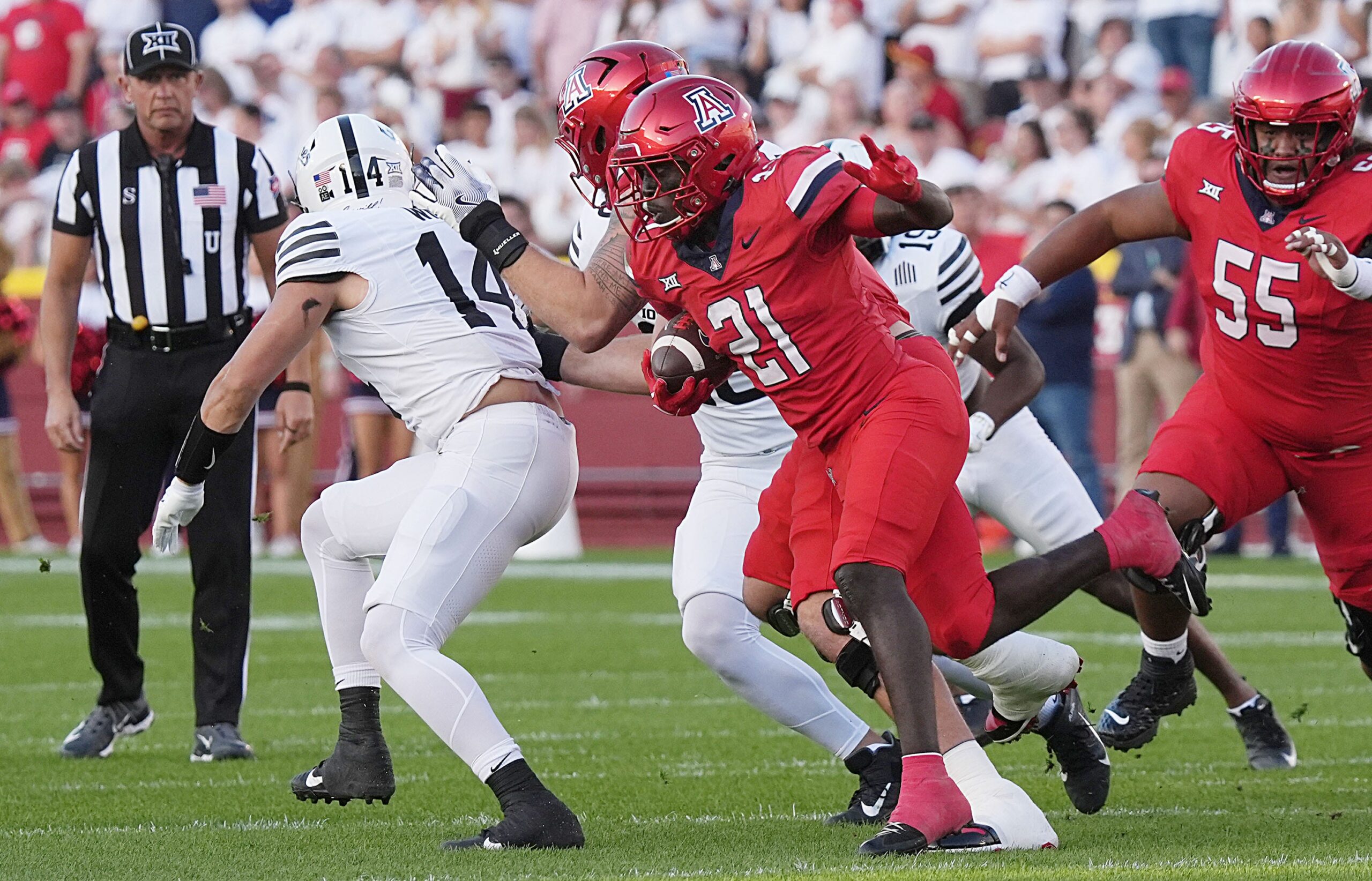Arizona Wildcats running back Ismail Mahdi (21)runs with the ball against Iowa state during the first quarter in the Big-12 conference showdown on Sept. 27, 2025, at Jack Trice Stadium in Ames, Iowa.