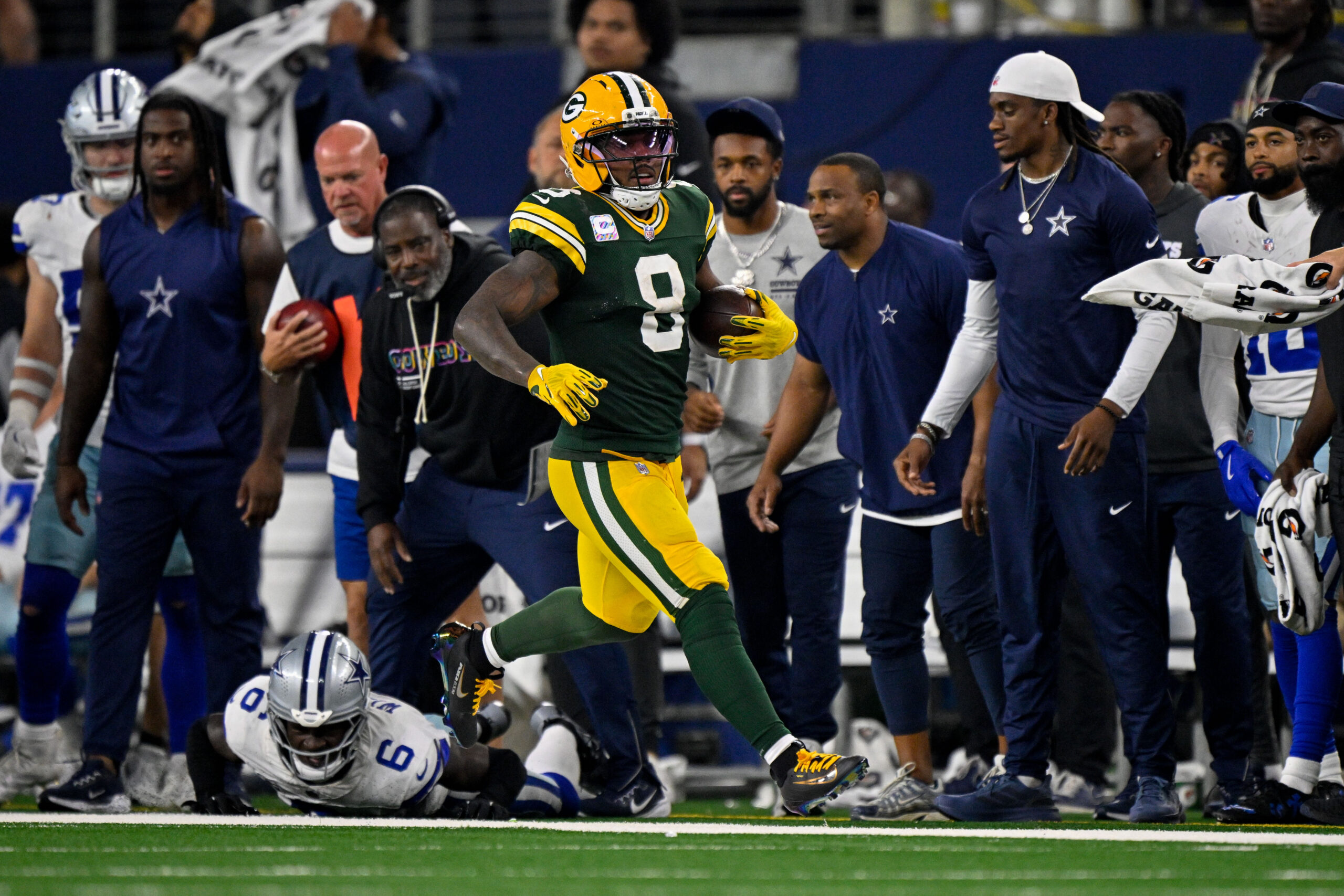 Sep 28, 2025; Arlington, Texas, USA; Green Bay Packers running back Josh Jacobs (8) runs with the ball during the game between the Dallas Cowboys and the Green Bay Packers at AT&T Stadium. Mandatory Credit: Jerome Miron-Imagn Images
