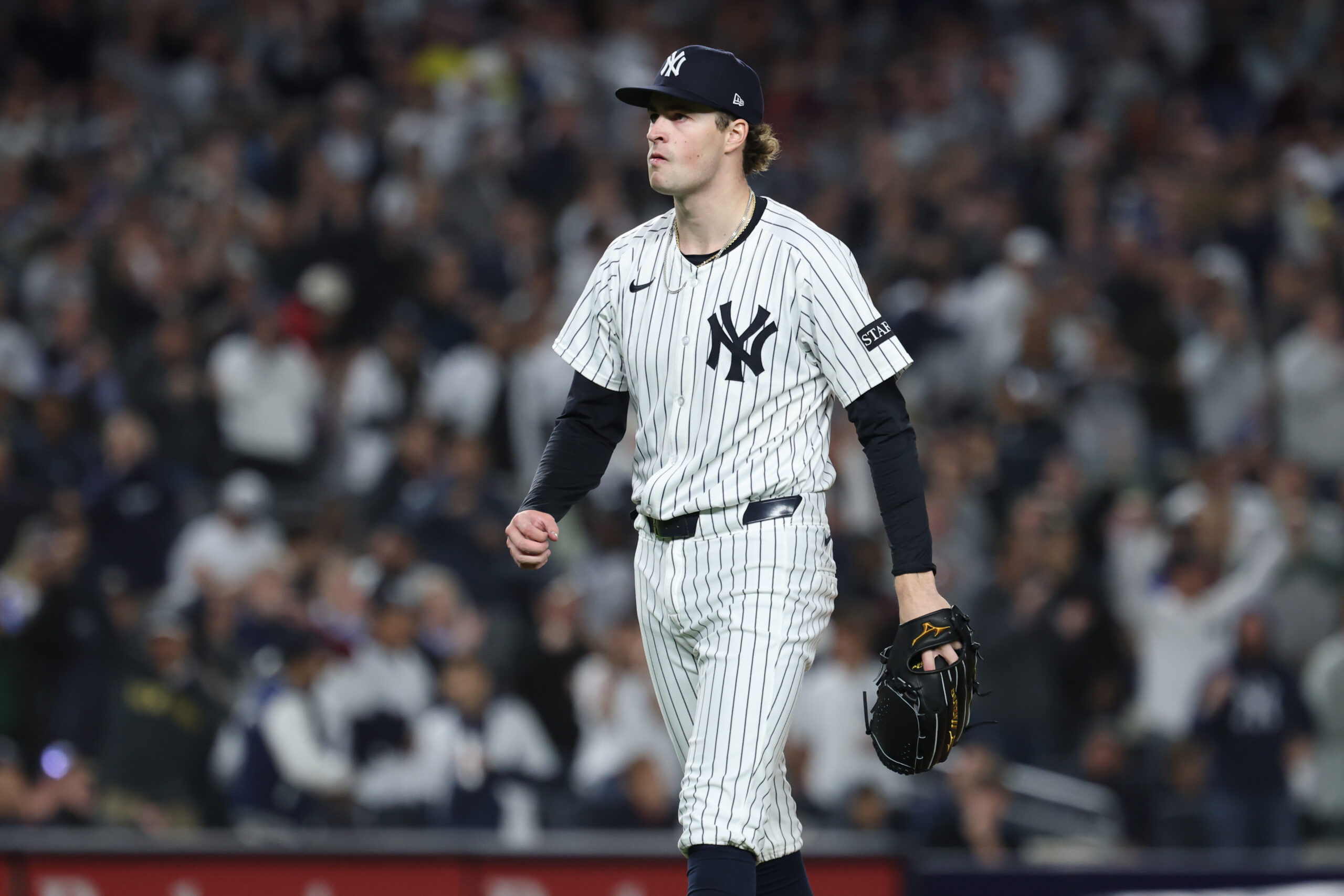 Oct 2, 2025; Bronx, New York, USA; New York Yankees pitcher Cam Schlittler (31) walks of the field after pitching the top of the sixth inning against the Boston Red Sox during game three of the Wildcard round for the 2025 MLB playoffs at Yankee Stadium. Mandatory Credit: Vincent Carchietta-Imagn Images