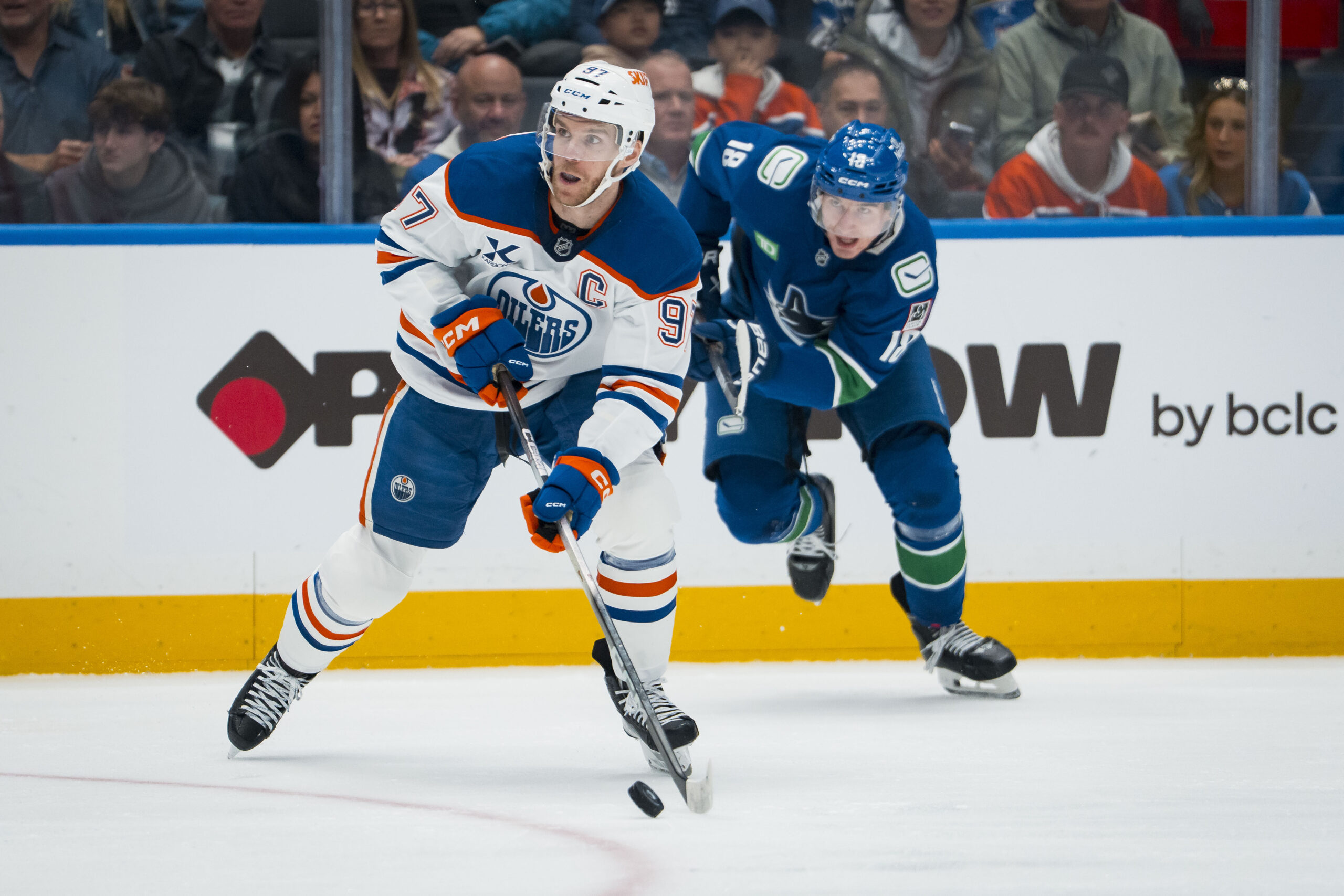 Oct 3, 2025; Vancouver, British Columbia, CAN; Edmonton Oilers forward Connor McDavid (97) handles the puck against the Vancouver Canucks in the second period at Rogers Arena. Mandatory Credit: Bob Frid-Imagn Images