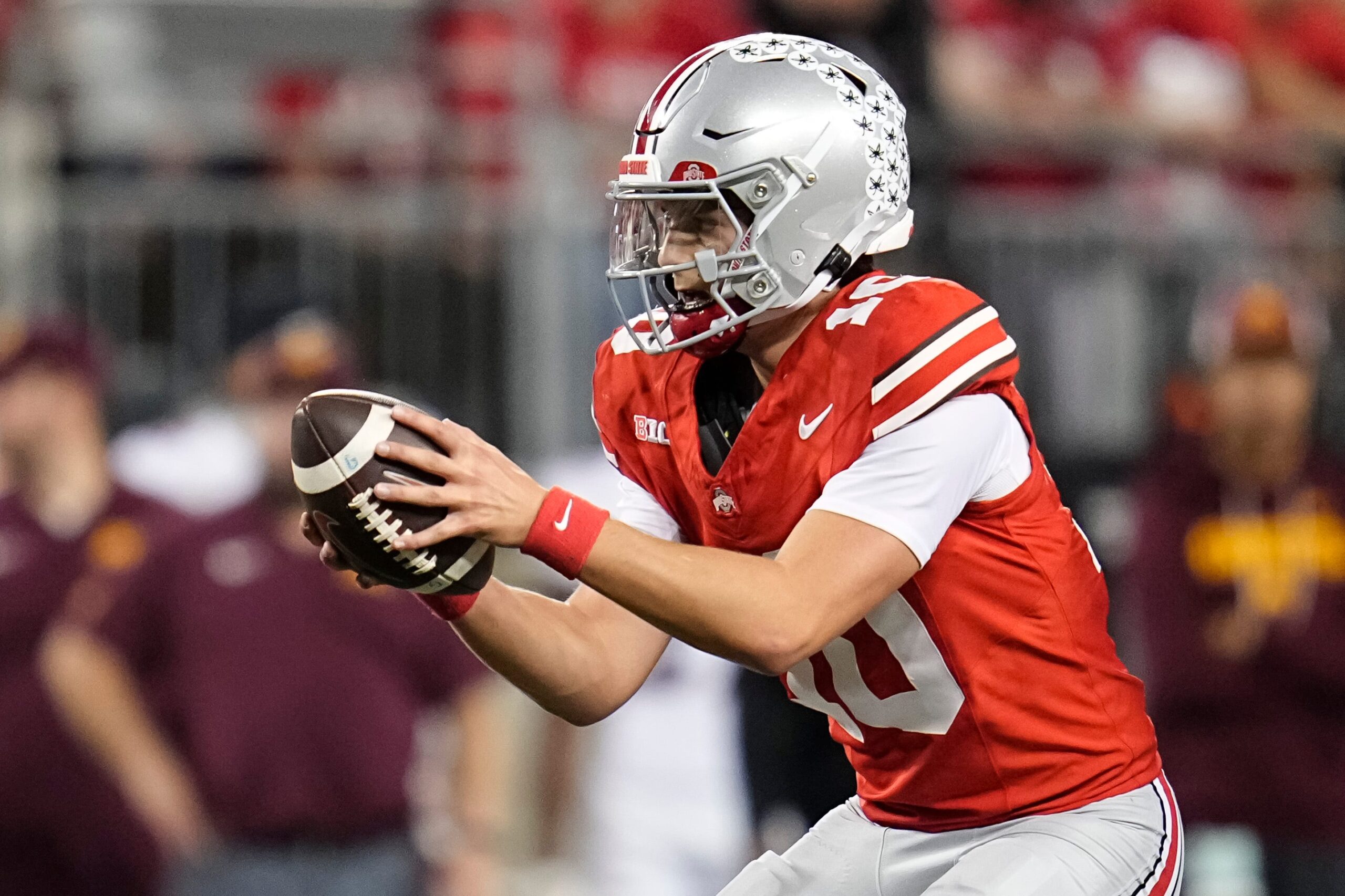 Ohio State Buckeyes quarterback Julian Sayin (10) takes a snap during the second half of the NCAA football game against the Minnesota Golden Gophers at Ohio Stadium in Columbus on Oct. 4, 2025. Ohio State won 42-3.