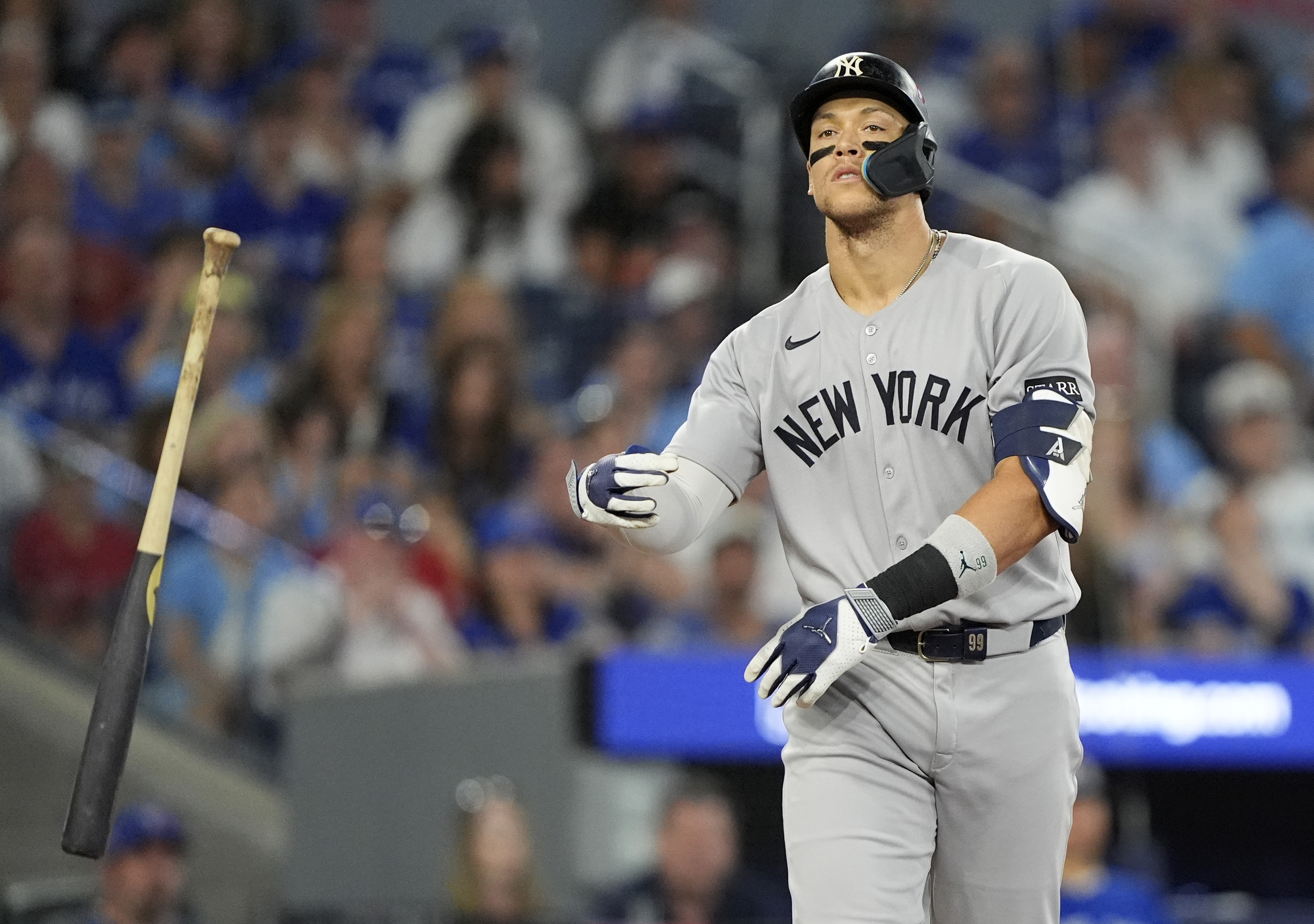 Oct 5, 2025; Toronto, Ontario, CAN; New York Yankees right fielder Aaron Judge (99) reacts after a walk in the ninth inning against the Toronto Blue Jays during game two of the ALDS round for the 2025 MLB playoffs at Rogers Centre. Mandatory Credit: John E. Sokolowski-Imagn Images