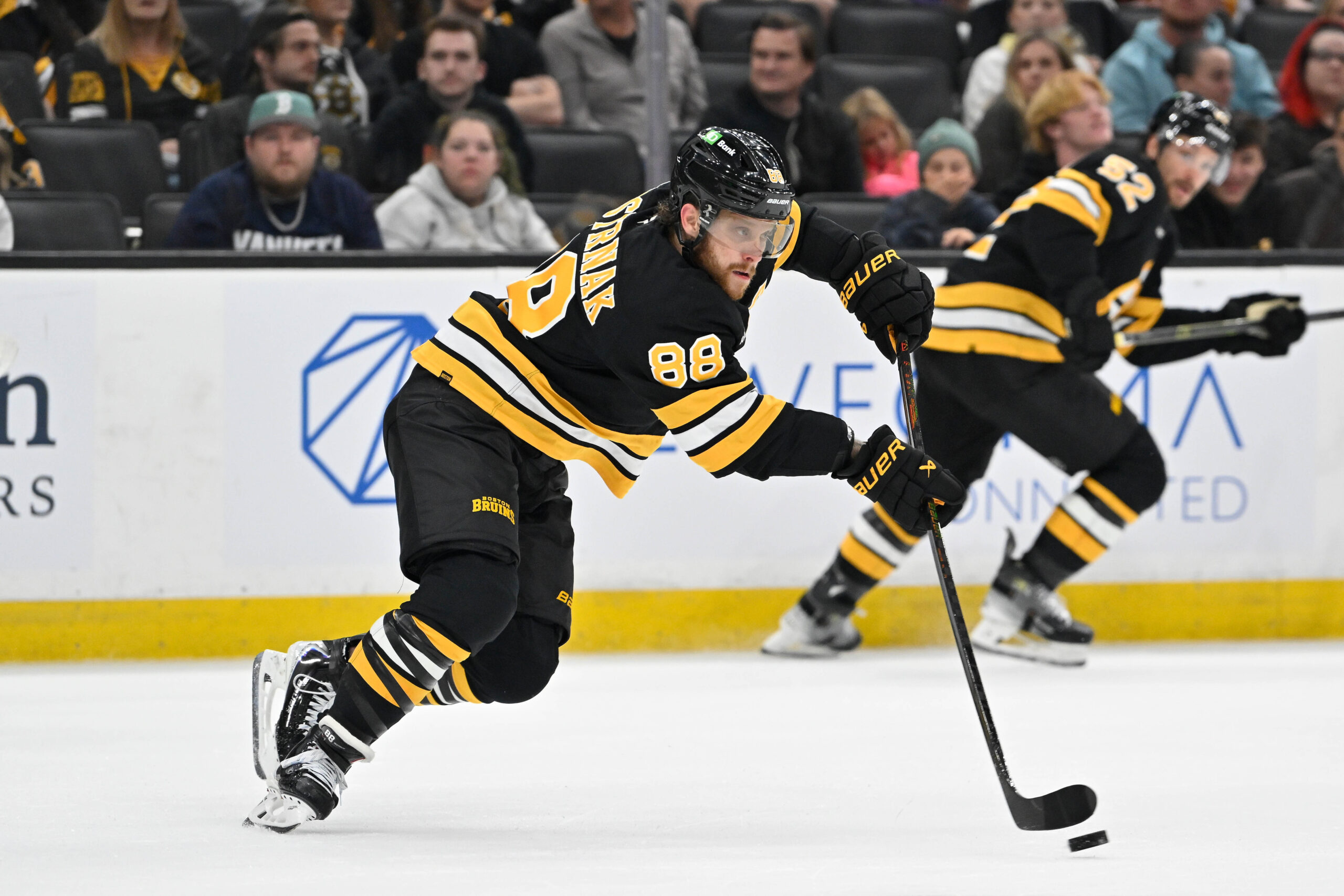 Sep 29, 2025; Boston, Massachusetts, USA;  Boston Bruins right wing David Pastrnak (88) passes the puck during the second period against the Philadelphia Flyers at TD Garden. Mandatory Credit: Eric Canha-Imagn Images