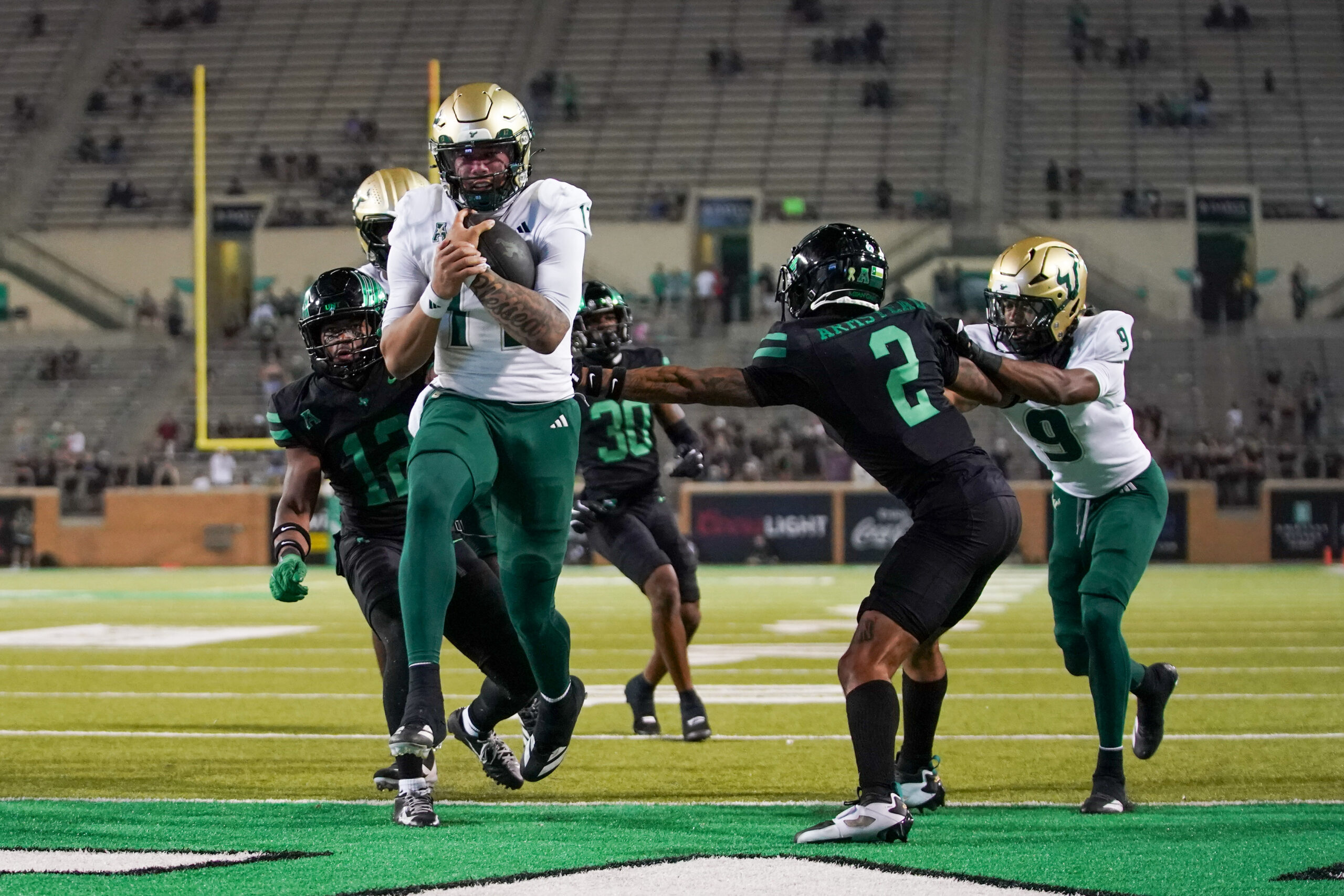 Oct 10, 2025; Denton, Texas, USA; South Florida Bulls quarterback Byrum Brown (17) carries the ball for a touchdown against the North Texas Mean Green during the second half of a game at DATCU Stadium. Mandatory Credit: Raymond Carlin III-Imagn Images