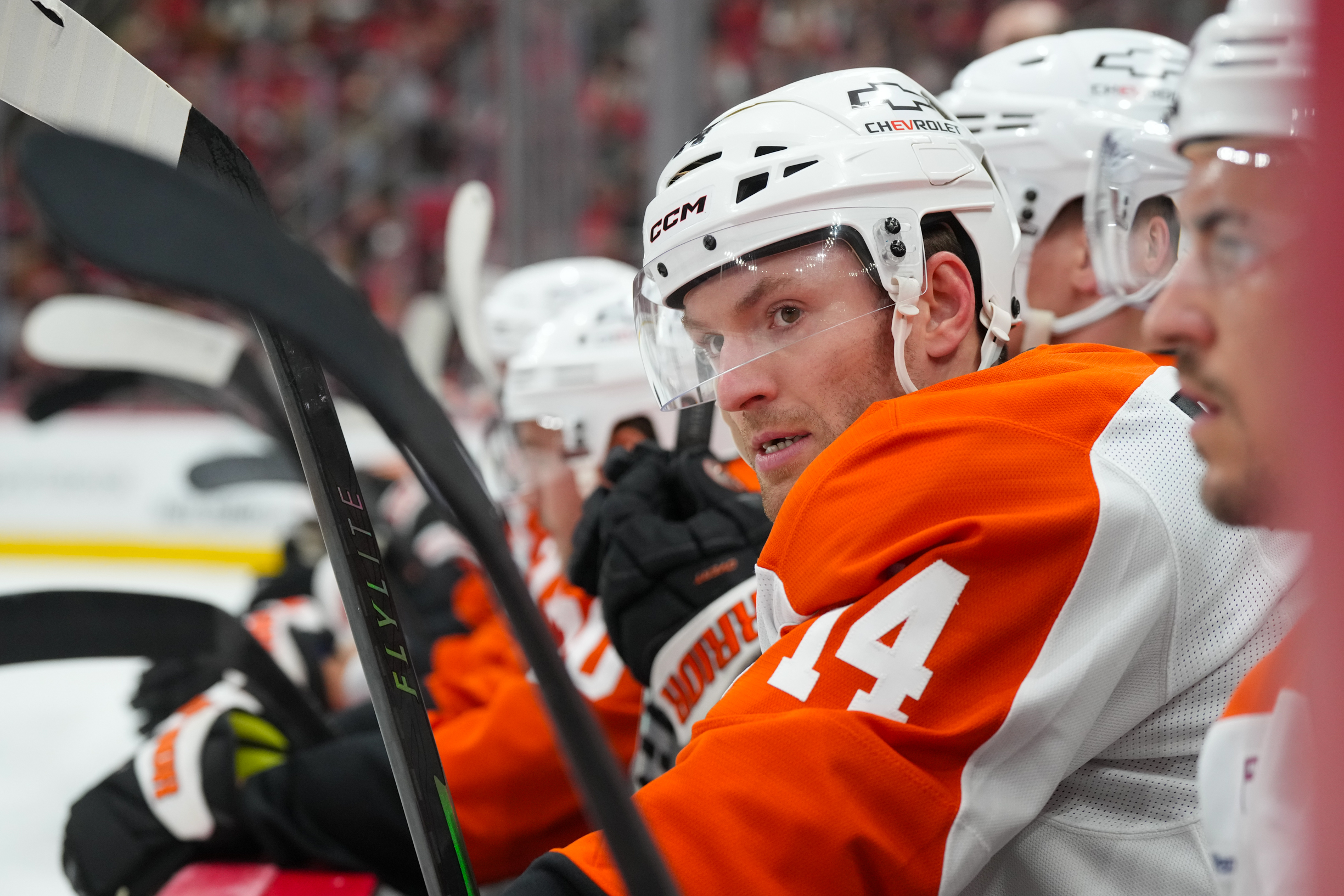 Oct 11, 2025; Raleigh, North Carolina, USA;  Philadelphia Flyers center Sean Couturier (14) looks on from the players bench against the Carolina Hurricanes during the first period at Lenovo Center. Mandatory Credit: James Guillory-Imagn Images