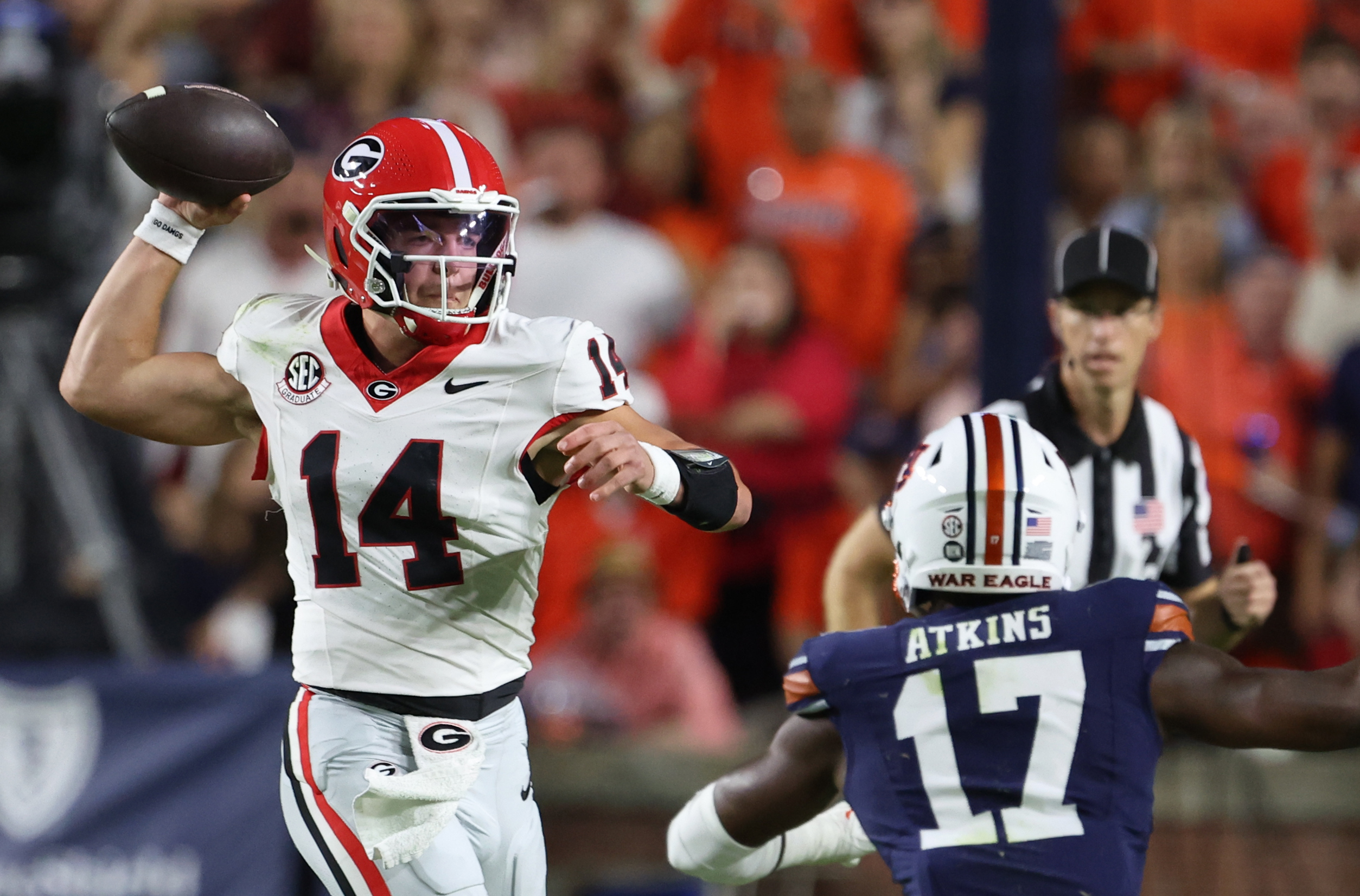 Oct 11, 2025; Auburn, Alabama, USA;  Georgia Bulldogs quarterback Gunner Stockton (14) looks for a receiver during the first quarter against the Auburn Tigers at Jordan-Hare Stadium. Mandatory Credit: John Reed-Imagn Images