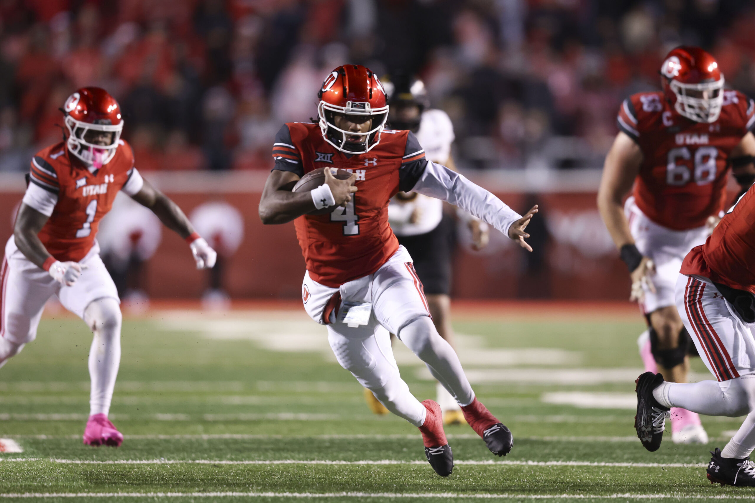 Oct 11, 2025; Salt Lake City, Utah, USA; Utah Utes quarterback Devon Dampier (4) runs the ball against the Arizona State Sun Devils during the third quarter at Rice-Eccles Stadium. Mandatory Credit: Rob Gray-Imagn Images