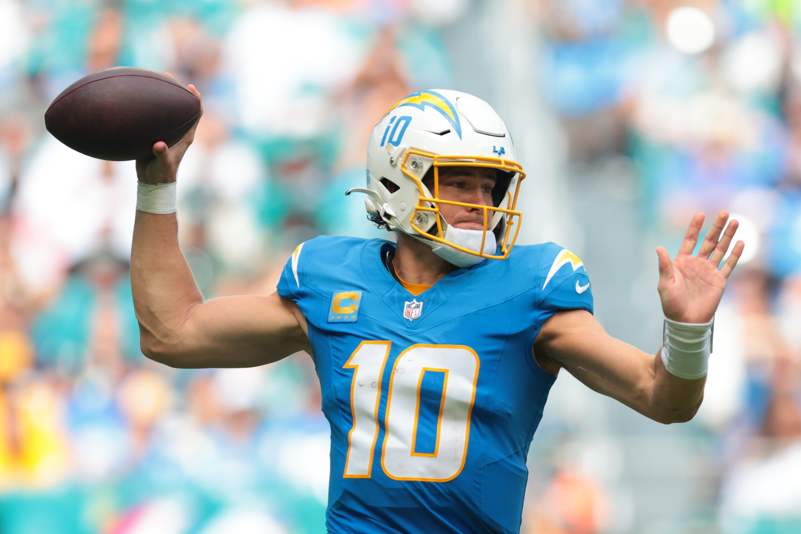 Oct 12, 2025; Miami Gardens, Florida, USA; Los Angeles Chargers quarterback Justin Herbert (10) passes the football against the Miami Dolphins during the fourth quarter at Hard Rock Stadium. Mandatory Credit: Sam Navarro-Imagn Images