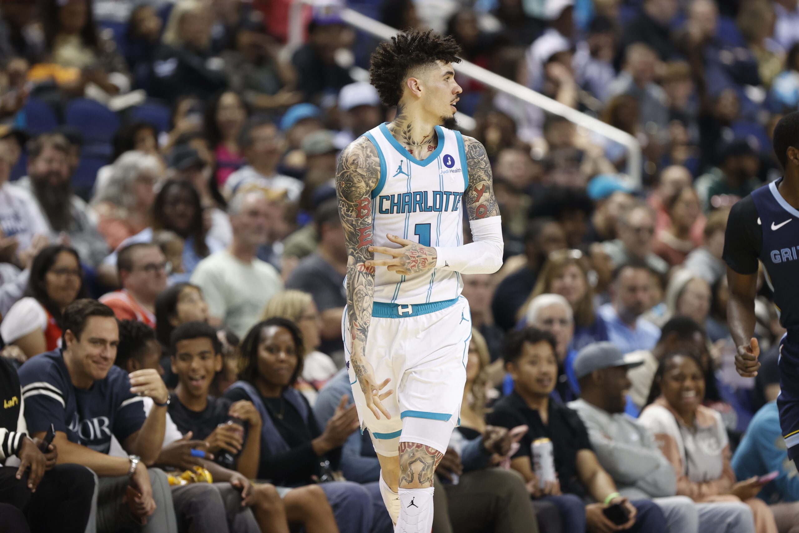 Oct 15, 2025; Greensboro, North Carolina, USA; Charlotte Hornets guard LaMelo Ball (1) celebrates after making a three-poiunt basket during the second half against the Memphis Grizzlies at First Horizon Coliseum. Mandatory Credit: Brian Westerholt-Imagn Images