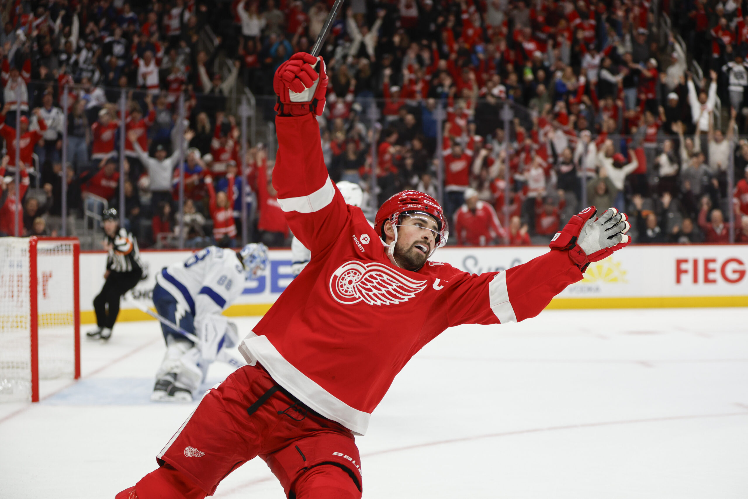 Oct 17, 2025; Detroit, Michigan, USA; Detroit Red Wings center Dylan Larkin (71) scores the game winning goal in overtime against Tampa Bay Lightning goaltender Andrei Vasilevskiy (88) at Little Caesars Arena. Mandatory Credit: Brian Bradshaw Sevald-Imagn Images