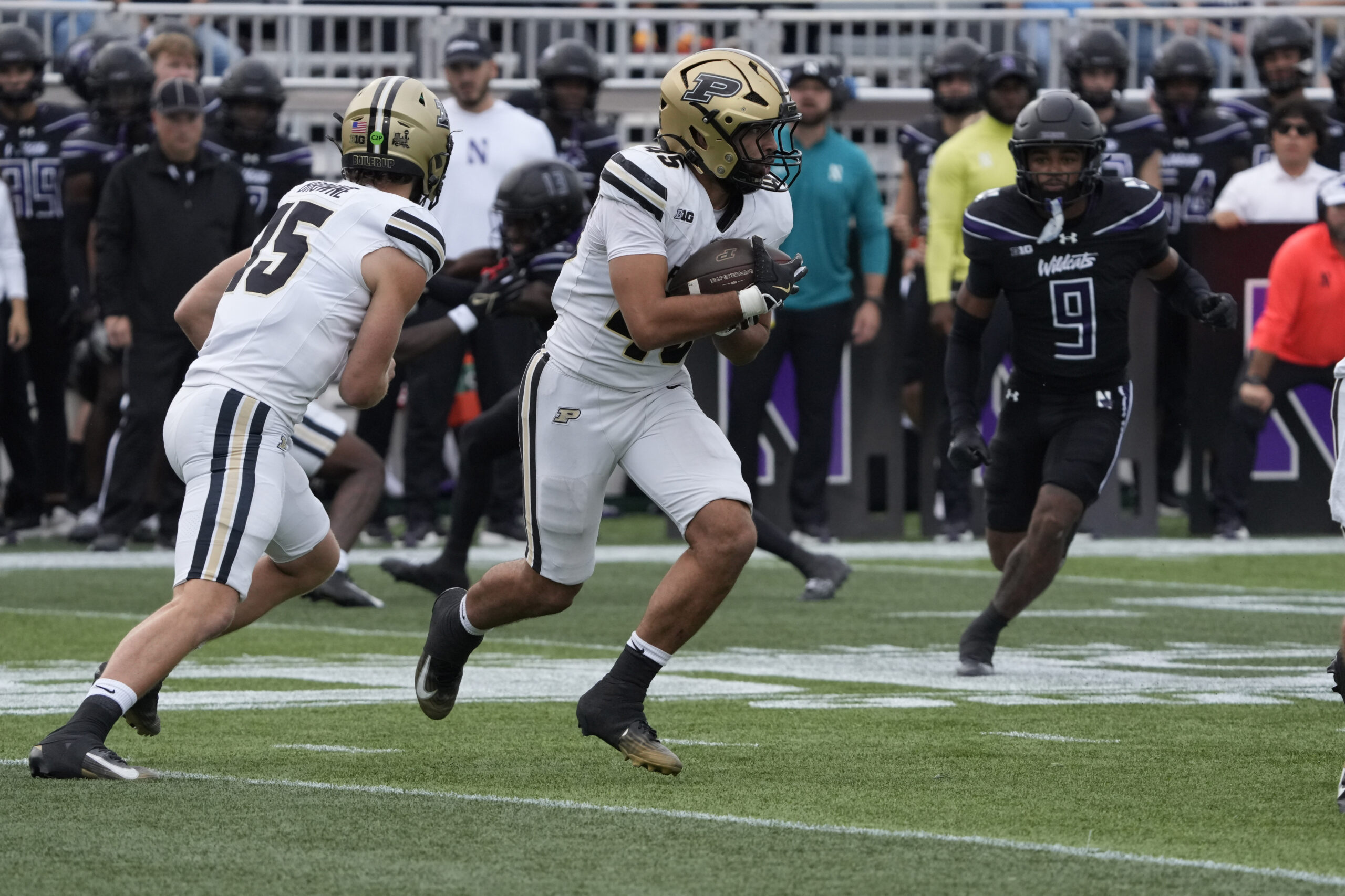 Oct 18, 2025; Evanston, Illinois, USA; Purdue Boilermakers running back Devin Mockobee (45) runs the ball against the Northwestern Wildcats during the first half at Northwestern Medicine Field at Martin Stadium. Mandatory Credit: David Banks-Imagn Images